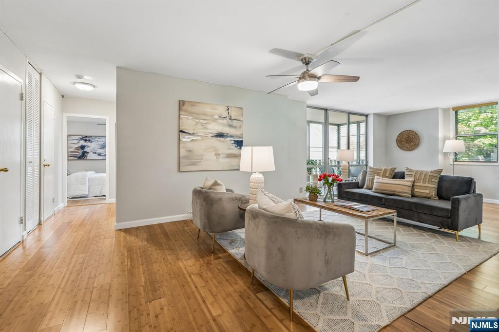 Welcome to The Bellaire House, Upper Montclair's premier condominium community. This beautifully updated, light-filled one bedroom residence offers exceptional convenience near to shops, restaurants, cafes, a supermarket, parks, and the Midtown Direct train station. The new galley kitchen features granite countertops, modern cabinetry and stainless steel appliances. The versatile open-concept design of the unit provides flexible space for entertaining, dining, and working from home, if desired. The spacious bedroom includes a wall of closets and abundant storage, complemented by updated bamboo floors throughout the unit make the home truly move-in ready. A private, enclosed balcony offers the perfect setting for morning coffee or evening relaxation and your plants will love it too! Two-zone heating and cooling enhance year-round comfort and efficiency. Residents enjoy a full-service amenity package, including a 24-hour attended lobby, elevators, outdoor pool, landscaped seating areas, barbecue area, dog run, on-premise parking, and laundry facilities on every floor. Bellaire House is pet-friendly, permitting one dog or cat under 30 pounds. Monthly HOA fees cover heat, hot water, gas, electric, central air conditioning, building services, common area maintenance, and pool access, delivering exceptional value and effortless living.