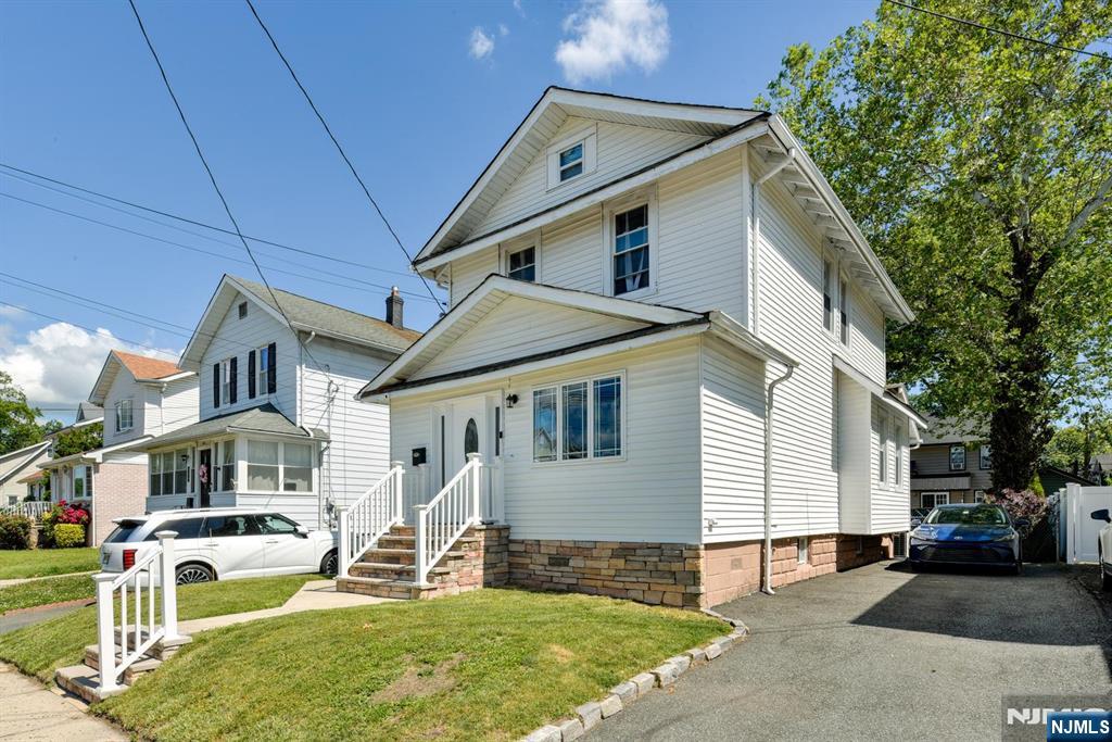 If you're looking for the perfect location to walk to Yanticaw Park, shopping and restaurants, schools and mass transportation to NYC, then this is a must see! This updated open concept home invites you into it's wonderful floor plan designed to entertain and cook a meal for a king in the incredible kitchen complete with center island. Or simply relax in the spacious living area. The rear den is the perfect spot for your home office with lots light and windows overlooking the tranquil backyard. Upstairs you'll be impressed by the hardwood floors leading to the spacious master BR with vaulted ceilings. The other two bedrooms offer versatile space to adapt to your lifestyle. The partially finished basement offers great storage or potential for more living space. Come be part of this amazing community with so much to offer and only 15 minutes to Met Life and American Dream mall.