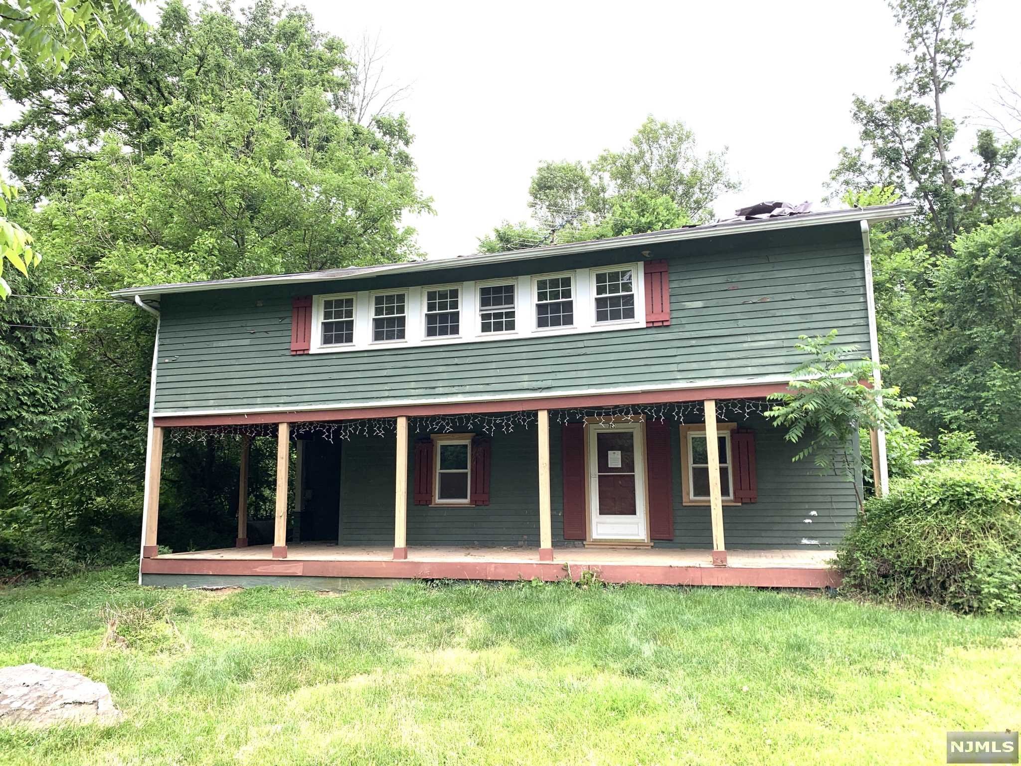 Cross your own private bridge that opens up into a beautiful 10+ acres of land surrounded by a preserve with plenty of privacy. With the right vision this 3 bed 1 full bath, 1 half bath, colonial farm house is waiting to be customized to fit your needs. There is parking for up to 8 cars as well as beautiful streams, natural paths, and enough land to create an outdoor paradise. Don't miss out come see it today.