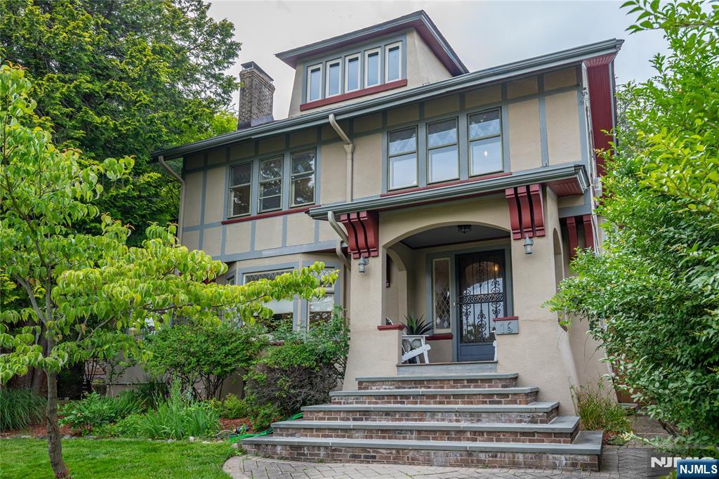 Set on one of Montclair's most exclusive and sought-after streets, this five-bedroom, three-bath residence is a masterful expression of architectural heritage, timeless craftsmanship, and refined living. Ideally positioned just moments from Montclair's vibrant downtown, acclaimed restaurants, cultural attractions, and direct NYC transportation. A stunning entry foyer introduces interiors of remarkable scale and elegance. Rich in character and architectural significance, the home showcases beautifully preserved original woodwork, jewel-toned stained glass, grand coffered ceilings, and exquisite parquet hardwood flooring with decorative border inlays, creating an atmosphere of timeless sophistication. Throughout, museum-quality millwork, artisan-crafted detailing, and heirloom-quality finishes celebrate the home's enduring craftsmanship and historic integrity. The formal living and dining rooms are distinguished by their impressive proportions, abundant natural light, and architecturally significant details. A versatile first-floor room offers flexibility and may serve as a tv room, guest suite, private office, or first-floor bedroom. The upper levels continue the home's legacy of elegance. The expansive primary suite is a true retreat, featuring generous dimensions, a charming fireplace, and serene views. Two additional bedrooms on this level. Occupying the third floor, a secondary primary suite includes a walk-in closet and full bath.
