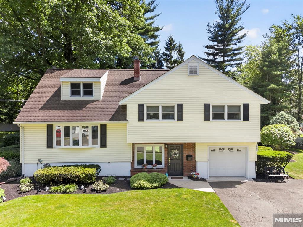 Welcome to this beautifully maintained sugar maple split-level home, offering approximately 2,100 square feet of living space in one of Westwood's most desirable neighborhoods. Featuring 4 generously sized bedrooms and 3 full bathrooms, including a primary suite with its own ensuite bath, this home provides the perfect blend of functionality and comfort. Tucked away at the end of a quiet cul-de-sac, you'll enjoy added privacy and minimal traffic. Step outside to your own private oasis featuring a heated salt water in-ground pool, newer trex deck, and a tranquil koi pond that creates the perfect setting for relaxation and outdoor entertaining. Conveniently located in one of Bergen county's most desirable communities, close to downtown shops, restaurants, parks, and transportation, this is an opportunity you won't want to miss. Book your showing before it's gone!