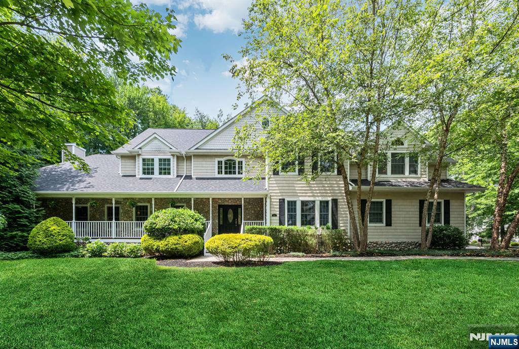 Welcome to your forever homeâ€”where curb appeal, timeless design, & stylish space is awaiting! Built in 2005 & located on a cul-de-sac, this irresistible stone-front Colonial offers 4 bedrooms plus office, 3.5 baths & almost 4000 SF of easy living! A storybook front porch with enchanting swing greets you & welcomes you into the 2-story foyer. Inside, the home unfolds into a sun-drenched living room with oversized windows, a dining room with wood floors, & a grand great room with vaulted ceilings, stone fireplace, & a wall of windows that draws the outdoors in. The beautiful eat-in kitchen is impressive with a center island, stainless steel appliances, a walk-in pantry, and an inviting dining area with glass doors that open to rear yard. Need a dedicated home office? The first-floor layout includes a private room perfect for flex space. A custom mudroom & direct access to the 3 -car garage is next along with a powder room. Upstairs, escape to your serene primary suiteâ€”an expansive 2 room sanctuary complete with a vaulted ceiling, sitting room or nursery (with laundry room) a spacious bath, & walk-in closet. 3 additional bedrooms and 2 full baths provide room for everyone. The finished lower level extends your living space with a rec room & gym. Step outside to the fenced backyard featuring a patio, mature plantings, and privacyâ€”ideal for hosting or unwinding. With alluring curb appeal, updates & generous space, this is a true Wyckoff gem!