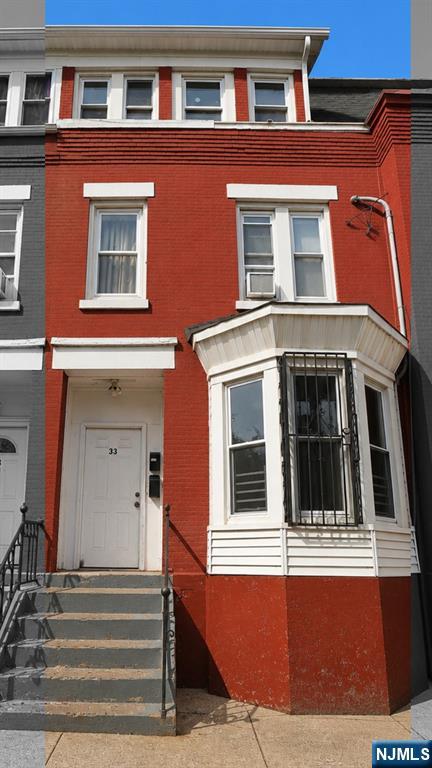 Welcome to this stunning brick brownstone nestled in the heart of Newark, NJ. This fully updated 2-unit multifamily exudes that coveted NYC and Jersey City brownstone charm, sitting on a 17.4x100 lot featuring a full basement and parking. Thoughtfully renovated in 2025 with modern finishes throughout, this property offers 6 bedrooms and 3 bathrooms across both units, with both currently tenant occupied and generating consistent rental income from day one. Perfect for the seasoned investor seeking immediate cash flow or an owner-occupant looking to live in one unit while collecting rental income from the other. Experience the charm and character of classic brownstone living at a fraction of NYC and Jersey City prices with low 2025 taxes. Conveniently located with easy access to major highways and NJ Transit for a seamless commute to NYC. Property can be purchased individually or as part of an exclusive package deal with 4 additional side by side brick brownstones on S 12th St totaling 5 properties. Opportunities like this do not last. Schedule your showing today.