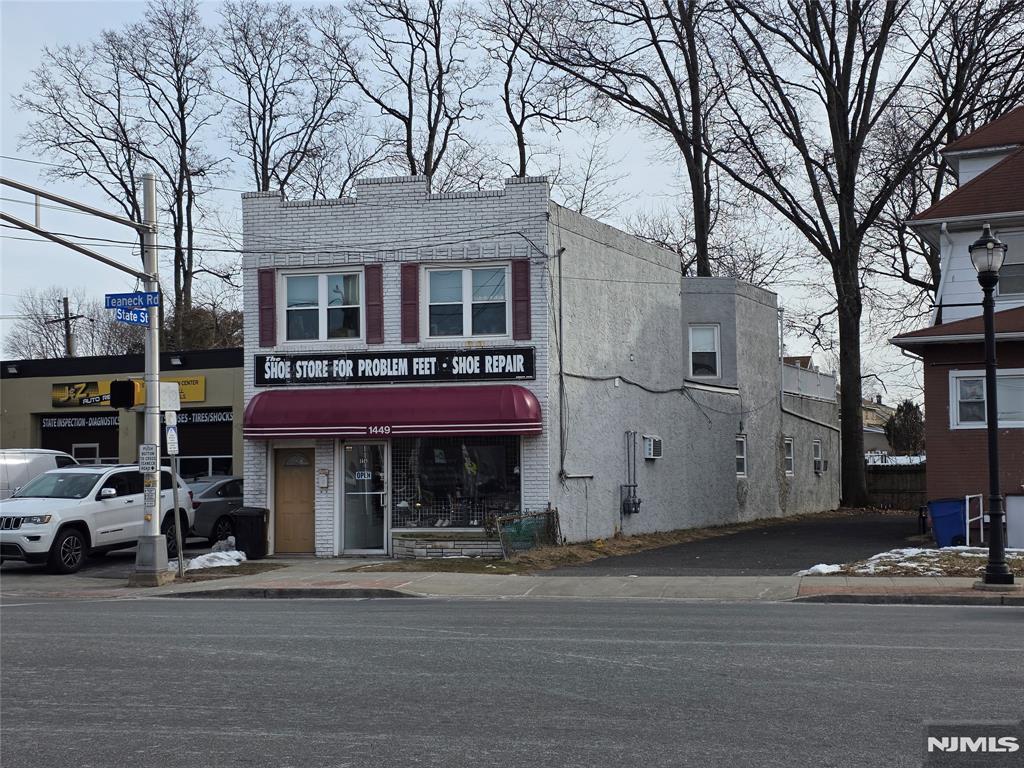 Solid mixed-use building at 1449 Teaneck Rd featuring a 2BR residential unit plus street-level storefront on a 20â€™ x 96â€™ lot. Concrete construction (1930) with no exterior maintenance. Zoned Business/Residential. Current income: $1,900/mo (2BR) and $1,600/mo (store) with clear upside potential in both units. Annual taxes approx. $11,180. 2 bed renovated in 2015 and in good condition, offering immediate cash flow with value-add opportunity through storefront renovation and rent increases. Residential unit heated by hot water boiler; storefront uses hot air heat, both window A/C. Tenant pay utilities, PSEG High-visibility Teaneck Rd location ideal for investors seeking stable income with long-term appreciation. Both units long term tenants who want to stay.