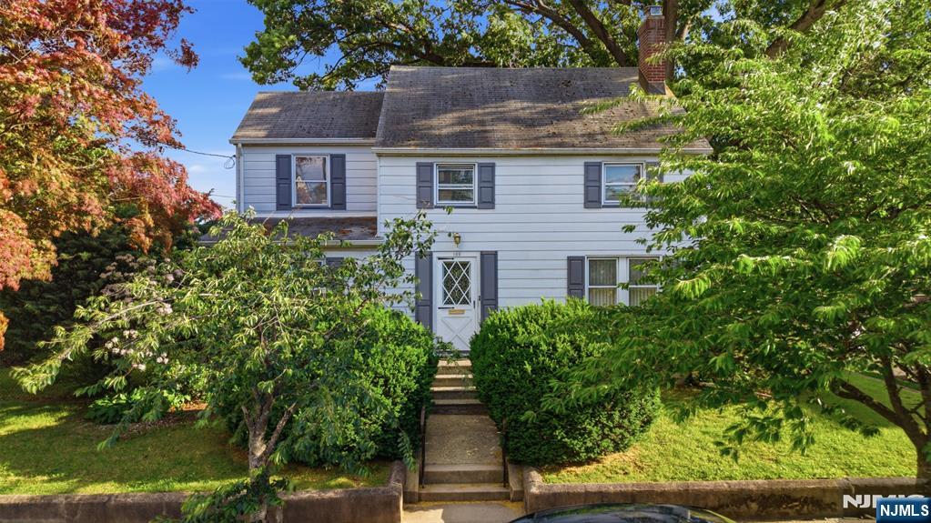 Wonderful opportunity to own this spacious and Colonial in Belleville's desirable Silver Lake section. Set on a generously sized lot surrounded by mature trees and lush landscaping, this 4-bedroom, 1.5-bath home is filled with character, charm, and endless potential. The first floor features a bright living room, formal dining room, cozy den, breakfast room, half bath and an enclosed porch perfect for enjoying morning coffee. Hardwood floors extend throughout the main level beneath much of the carpeting. The second floor offers four well-sized bedrooms and a full bath, providing ample space for family, guests, or a home office. A semi-finished basement adds additional flexibility for recreation, storage, hobbies, or future expansion. Outside, enjoy the privacy and beauty of the expansive yard, abundant greenery, and detached 2-car garage. Lovingly cared for over the years, this classic Colonial presents a rare opportunity to preserve its timeless character while adding your own personal touches. Conveniently located near parks, schools, shopping, transportation, and major commuter routes, this is a home you won't want to miss.