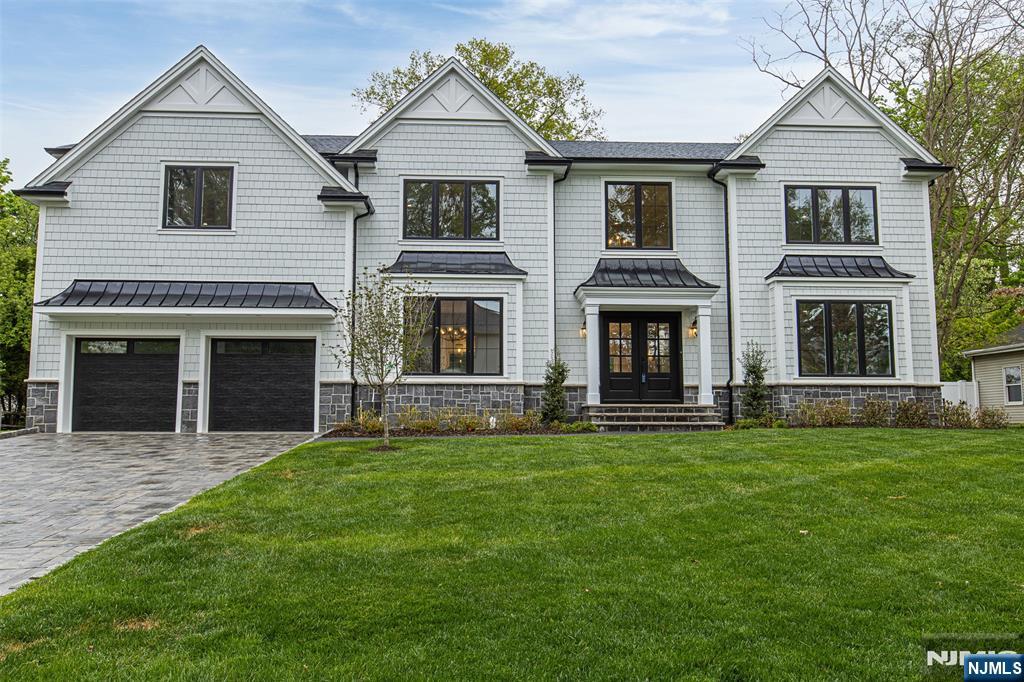 Welcome to this newly built luxury residence offering an unparalleled blend of modern design and with classical elegance. With approximately 6,700 square feet of living space, this expansive 6-BR, 5.5-Bth home is situated on a generous 100 x 150 lot. Youâ€™re greeted by a paver driveway and walkway that leads to a stately entrance. Inside, discover hardwood floors throughout, soaring ceilings, and a sophisticated open-concept layout designed for both comfort and entertaining. The heart of the home is a modern kitchen, featuring Sub-Zero and Wolf premium appliances, sleek cabinetry, and an oversized center island with quartz countertops. All six bedrooms are generously sized, each offering ample closet space. The luxurious primary suite boasts a designer bath, 2 custom walk-in closets, and peaceful backyard views. The home also includes a full finished basement, ideal for a media room, gym, playroom, guest quarters, or all of the aboveâ€”offering exceptional flexibility and additional living space. Step outside to your private backyard oasis featuring a bluestone patio and mature trees for added privacy. Located in the heart of Demarest, with top-rated schools, scenic parks, and convenient access to NYC, this exceptional property presents a rare opportunity to own brand-new construction in an established, sought-after community.
