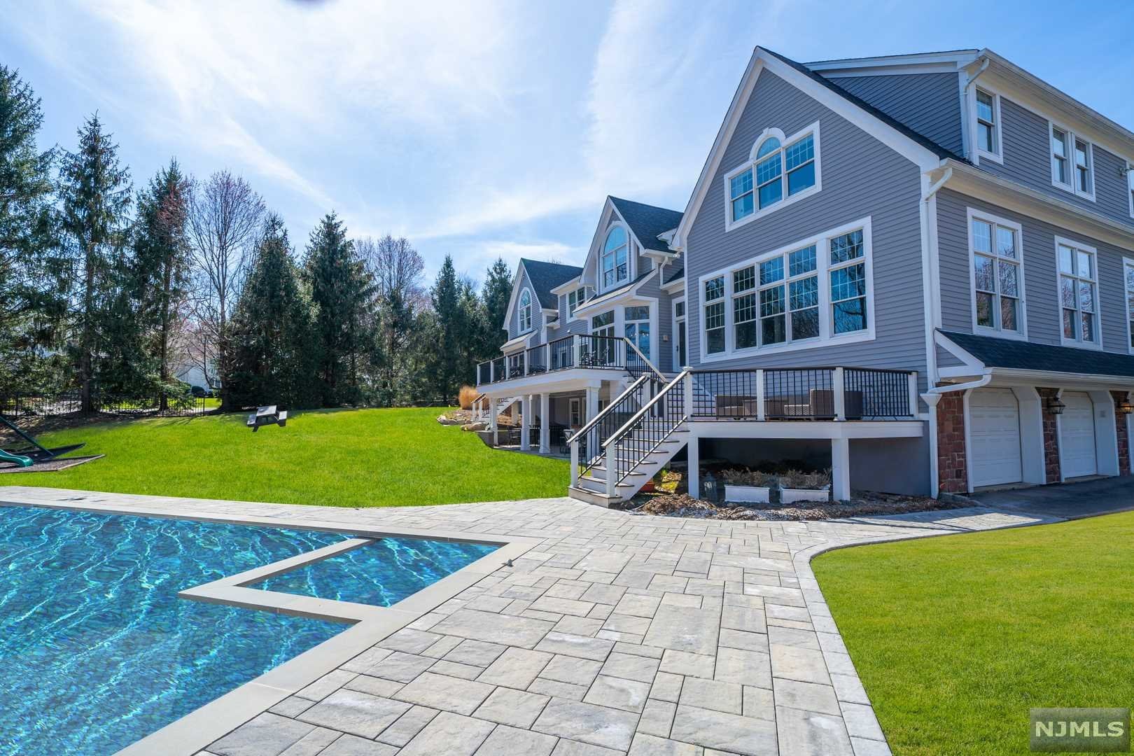 Tranquil water views, glorious sunrises, and crimson sunsets await along Baker Pond in this very special home sweet home. A picturesque cul-de-sac setting, this charming estate has been completely renovated over the last 4 years along with a brand new gunite in-ground pool over looking the pond that's currently been installed! This lovely home features 5 bedrooms, 5.5 baths, 3 car garage, 1.03 acre property, & a finished walk-out basement w/ full bath. Designer kitchen featuring Wolf appliances/sub-zero/marble countertops/center island/sun-drenched breakfast nook. Exquisite master bedroom/his and her WIC and gorgeous modern masterbath w/ radiant floors. Attentive architectural design with a wall of windows across the rear of the home to take advantage nature's everyday beauty/three different outdoor landings as well to soak it all in! Now is your chance to reserve memorable sunset views for a lifetime as opportunities like this do not come around very often!
