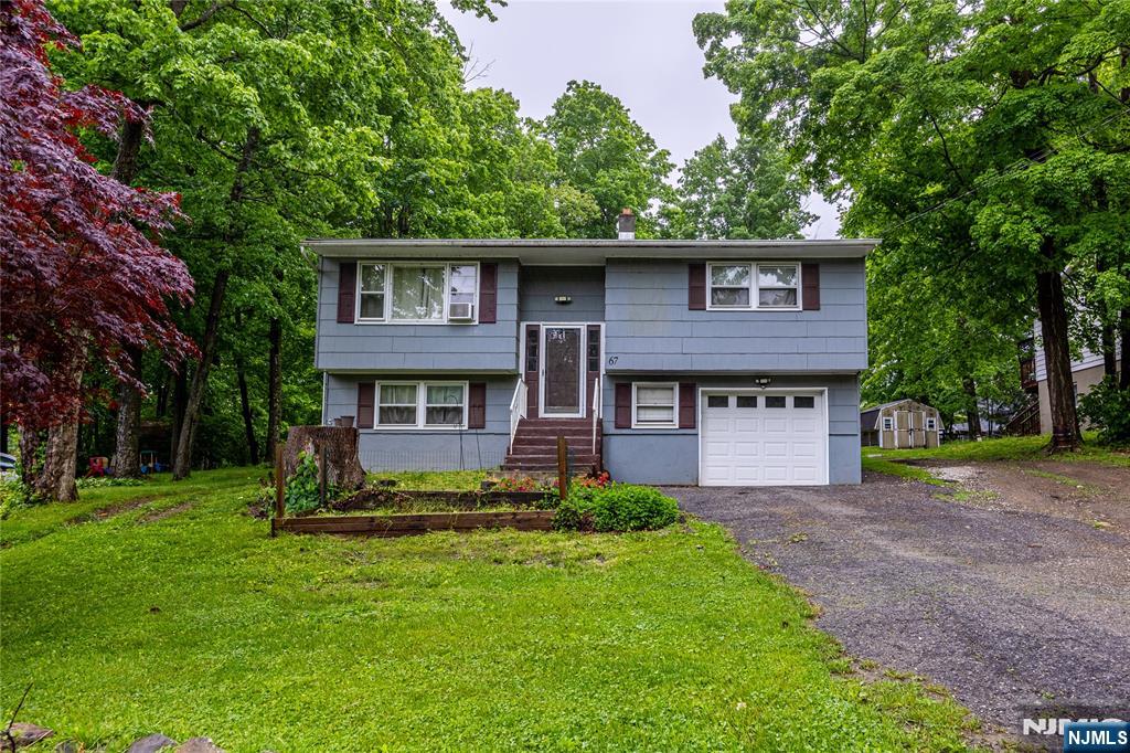Opportunity awaits in the desirable Barry Lakes community! This 3-bedroom, 1.5 bath bi-level offers great potential for buyers looking to add their own vision and updates. The main level features 2 bedrooms, 1 full bath, a bright living room, spacious kitchen, and separate dining area with sliders leading to a large deck, perfect for enjoying the peaceful wooded surroundings. The lower level offers additional living space, a 3rd bedroom, and plumbing already installed for a future half bath, just awaiting fixtures and finishing touches. With a little TLC, this home offers a fantastic opportunity to build equity while creating the lifestyle you've been looking for. Enjoy all the perks of Barry Lakes living including lake access, beaches, boating, fishing, playgrounds, and a welcoming community atmosphere. Ideally located near hiking trails, golf courses, local farms, wineries, breweries, and year-round recreation. Just minutes to Mountain Creek for skiing, snowboarding, mountain biking, and waterpark fun, plus nearby Warwick, NY for restaurants, shopping, orchards, and seasonal festivals. Convenient commuter access while surrounded by the natural beauty and outdoor lifestyle that makes Vernon such a sought-after destination.