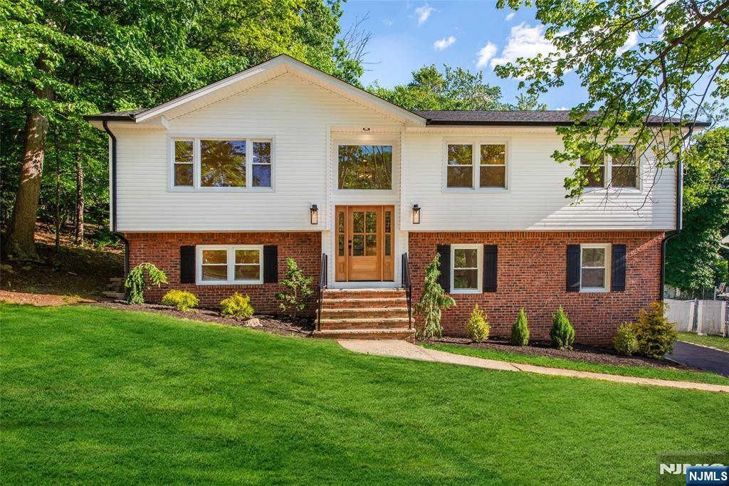 Welcome to this renovated Bi-Level home in the highly sought-after St. Cloud neighborhood of West Orange. Offering 4 bedrooms, 3 full baths, and an oversized two-car garage with high ceilings, this move-in-ready home combines modern updates with exceptional functionality. The sun-filled main level features a stunning new kitchen with a large center island seating four, seamlessly flowing into the dining area and spacious family room perfect for everyday living and entertaining. This level also includes 3 generously sized bedrooms & 2 beautifully renovated full bathrooms. The walkout lower level provides exceptional flexibility with a private bedroom, full bath, and living area, making it ideal for guests, extended living, or an in-law suite. Recent upgrades include a new kitchen, renovated bathrooms, HVAC system, tankless water heater, updated electrical and plumbing, refinished hardwood floors, new driveway, and much more. Ideally located just minutes from top-rated schools, Essex County Country Club, South Mountain Reservation, Turtle Back Zoo, shopping, dining, major highways, and NYC transportation. Residents also enjoy complimentary Jitney service to Orange, South Orange, and Brick train stations, providing convenient Midtown Direct service to New York Penn Station. A rare opportunity to own a turnkey home in one of West Orange's most desirable neighborhoods. Agent Remarks: Call or text Tricia @ 516-503-3350 to show or with any questions.