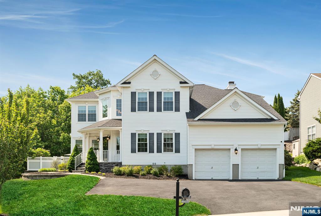 Welcome to luxurious living at its finest, where high end upgrades and appointments create an atmosphere of beauty, comfort and peace of mind for years to come. This stunning home and property includes everything you have been searching for and so much more than you would have expected. Featuring over $370K in premium enhancements including NEW ROOF, NEW WINDOWS, NEW DUAL HVAC SYSTEMS, NEW TANKLESS WATER HEATER, just to name a very few. Upon approach, be greeted by a grand driveway expansion with radiant heating system for handling ice and snow. Gorgeous hardscaped paver work with limestone and cultured stone line the custom walkway. Step inside a dramatic, award winning floorplan with spacious rooms and flex spaces spread over three levels. Custom moldings/trims & silhouette blinds create an elegant designer look in every room. Sunny and bright kitchen with breakfast room nicely equipped with stainless appliances, 42 inch cabinetry & center island/bar. Primary bedroom suite has dual walk in closets & ensuite bath with soaking tub, shower and dual sinks. Fabulous finished basement with multiple storage rooms is perfect for recreation and has a dedicated gym room. RESORT STYLE BACKYARD OASIS is a sight to behold and a place you will love to come home to. Enjoy a BEAUTIFULLY MANICURED outdoor retreat with its kidney shaped HEATED SALTWATER POOL, surrounded by custom designed patios, walkways, firepit, shed, lawn and fenced in property. PUBLIC UTILITIES and an EASY NYC COMMUTE!