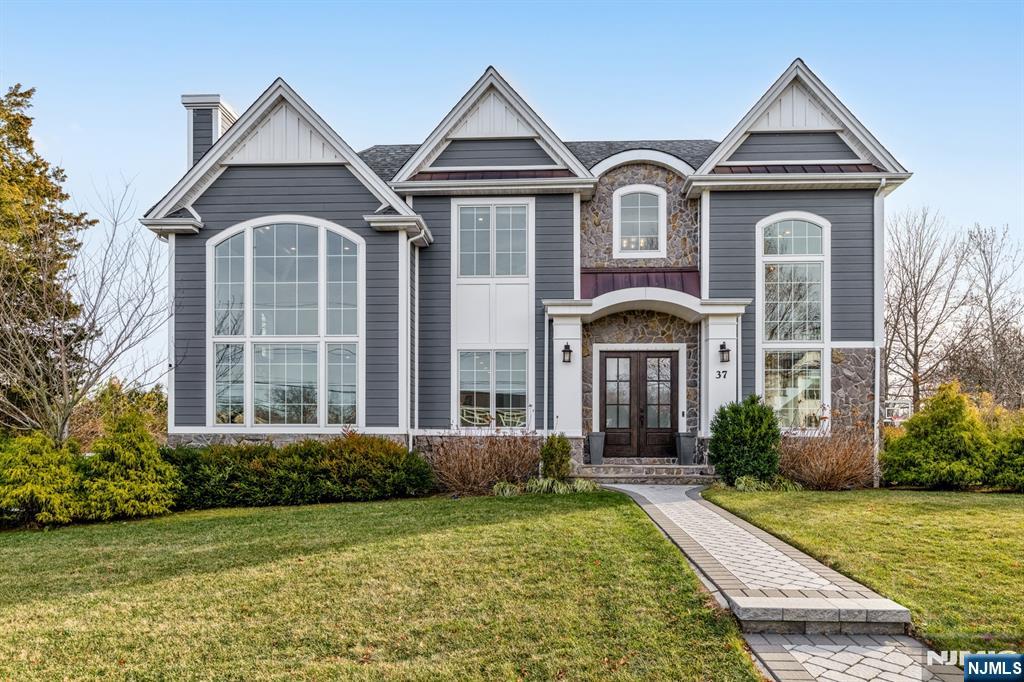 Welcome to a truly exceptional Glen Rock residence that blends timeless craftsmanship with modern luxury. Only 7 years old and built by one of Bergen Countyâ€™s premier builders, this stunning home with 6 bed 5.5 baths and approx. 6,330 sq ft on all levels, offers timeless design and curb appeal with Hardie Plank siding, Azek trim, stone accents, a paver driveway, walkways, and a fully fenced backyard with patio. Inside, 10â€™ ceilings and a dramatic two-story foyer and great room set the tone for elevated living. The designer kitchen features custom St. Martin cabinetry, quartz countertops, a large center island, and a premier appliance package including Sub-Zero, Wolf, and Miele. The great room showcases a gas fireplace and beautiful custom millwork. First-floor guest suite. Serene primary retreat with dual walk-in closets and a spa-like bath with oversized shower and soaking tub. Very spacious bedrooms with custom, finished closets. The fully finished basement offers the 6th bedroom, a large rec room, a full bath, and a theater-ready bonus room. Advanced systems include 4-zone HVAC, 200-amp electric, central vac, & a 20kW generator. Upgrades such as a Tesla charger, whole-house water filtration, custom window treatments, Elfa garage storage, & Ring cameras complete this magazine-worthy home in a dream location, walking distance to the elementary school. Glen Rock offers excellent schools and a wonderful community.