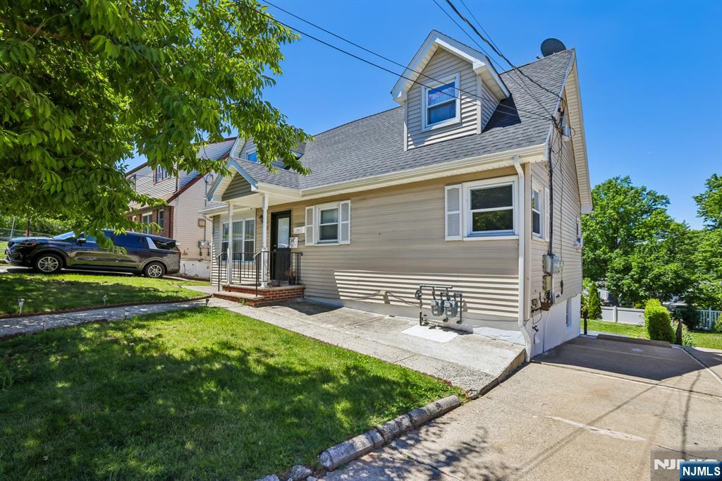 Nestled on a quiet residential street near the Saddle Brook border, this spacious first-floor rental in a two-family home offers the comfort and flexibility of house-style living. Featuring 3 bedrooms, 2 full baths, and a walkout basement, there's room to live, work, and entertain. The main level includes a welcoming living room, dining area, kitchen, three bedrooms, and a full bath. The finished basement expands the living space with a family room, second full bath, laundry area, and direct access to the backyard. Outside, enjoy full use of the yard and patioâ€”perfect for relaxing, entertaining, or simply enjoying the outdoors. The landlord provides two off-street parking spaces, lawn care, water, and sewer. Ideally located near shopping, dining, major highways, and public transportation, this home offers the perfect blend of space and accessibility.