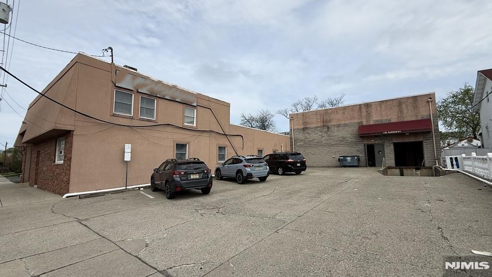 Highly functional, free-standing warehouse with office for SALE. Situated on a 16,841 SF lot, this 15,190 SF facility features an ideal layout split between a high-ceiling warehouse and a functional corporate office. Equipped with a tailgate dock, a drive-in door, and 9 on-site parking spaces, the property ensures seamless shipping, receiving, and fleet management. Generous 18â€“20 ft clear ceilings maximize vertical storage and racking efficiency. Its unbeatable logistics location just off S. River St. offers lightning-fast access to major highways and NYC, making it a premier spot for last-mile distribution. Crucially for workforce retention, the facility sits just a 5-minute walk from the Essex Street Train Station. This exceptional transit-oriented footprint adds massive intrinsic value for developers, investors, and multifamily buyers. Furthermore, being immediately adjacent to Hackensack's rapidly transforming Downtown Rehabilitation District and the Essex/Huyler Street redevelopment corridors, the property is poised to capitalize on modern, high-density mixed-use growth and infrastructure improvements. Don't miss out on this rare opportunity to unlock multi-faceted valueâ€”perfect for investors, developers, and 1031 exchanges. Property sold "As-Is."