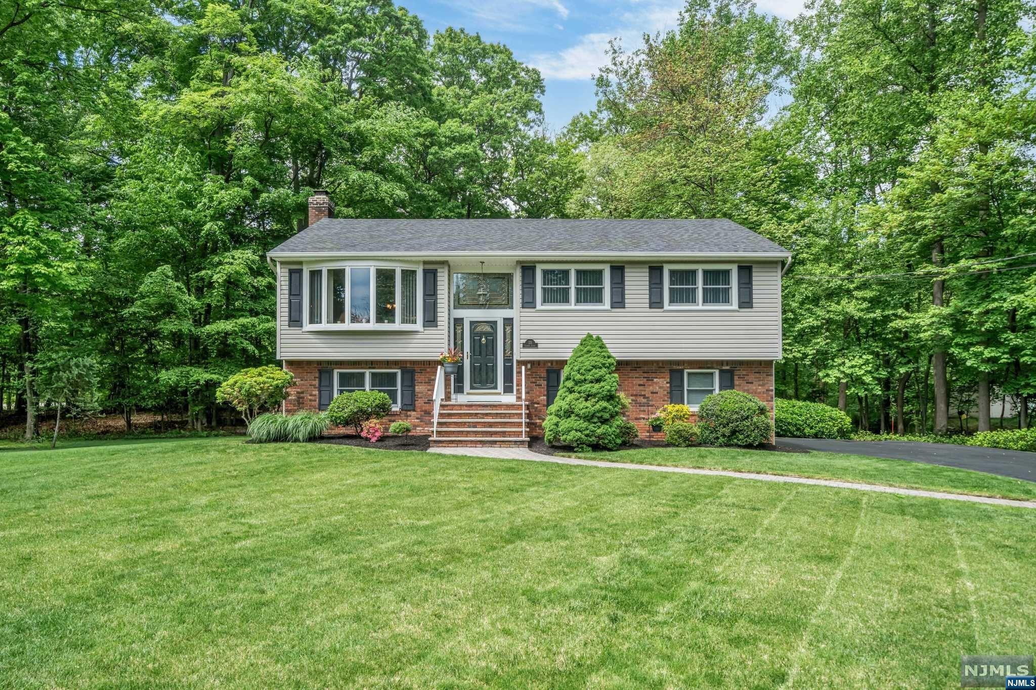 Welcome home to this gorgeous and extremely well maintained 3 Bedroom / 2 Bathroom Bi-Level situated at the end of cul-de-sac on a beautiful lot in highly sought after Washington Township. Featuring hardwood floors, central AC, baseboard heat, fireplace, ample sunlight throughout the day, deck, newer roof, and two car attached garage, this home is sure to please. Main level features living room, dining room w/ sliders to deck, Chef's kitchen, three spacious bedrooms, and full bathroom. Chef's kitchen includes SS appliances, granite countertops, gorgeous custom cabinets, and breakfast bar. Ground level features family room with wood burning fireplace, office, full bathroom, laundry / utility room, and two car garage. Completing this home is a beautiful backyard with paver patio and shed. Located near plenty of shopping, restaurants, public transportation, major highways, and award winning schools, this is truly a home you don't want to miss!