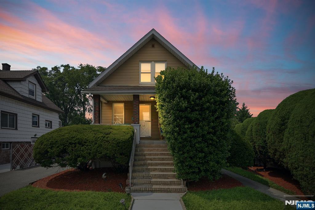 Welcome to this well-maintained home offering the perfect blend of comfort, space, and outdoor living. From the inviting front porch to the oversized backyard, this home is designed for both everyday living and entertaining. The first floor features a spacious living room, formal dining room, kitchen with mud room and access to a rear deck, and powder room for guests. The primary bedroom suite is also located on the main level, convenience with easy one-floor living. Upstairs, you'll find two generously sized bedrooms and a full bathroom. A full basement provides plenty of storage and endless possibilities for additional living. Step outside and enjoy your own backyard retreat. The expansive deck overlooks a large in-ground swimming pool, creating the perfect setting for summer gatherings. Additional highlights include a three-car garage, an extra-long driveway with parking for approximately four vehicles, and outstanding curb appeal, in a desirable Little Ferry location.