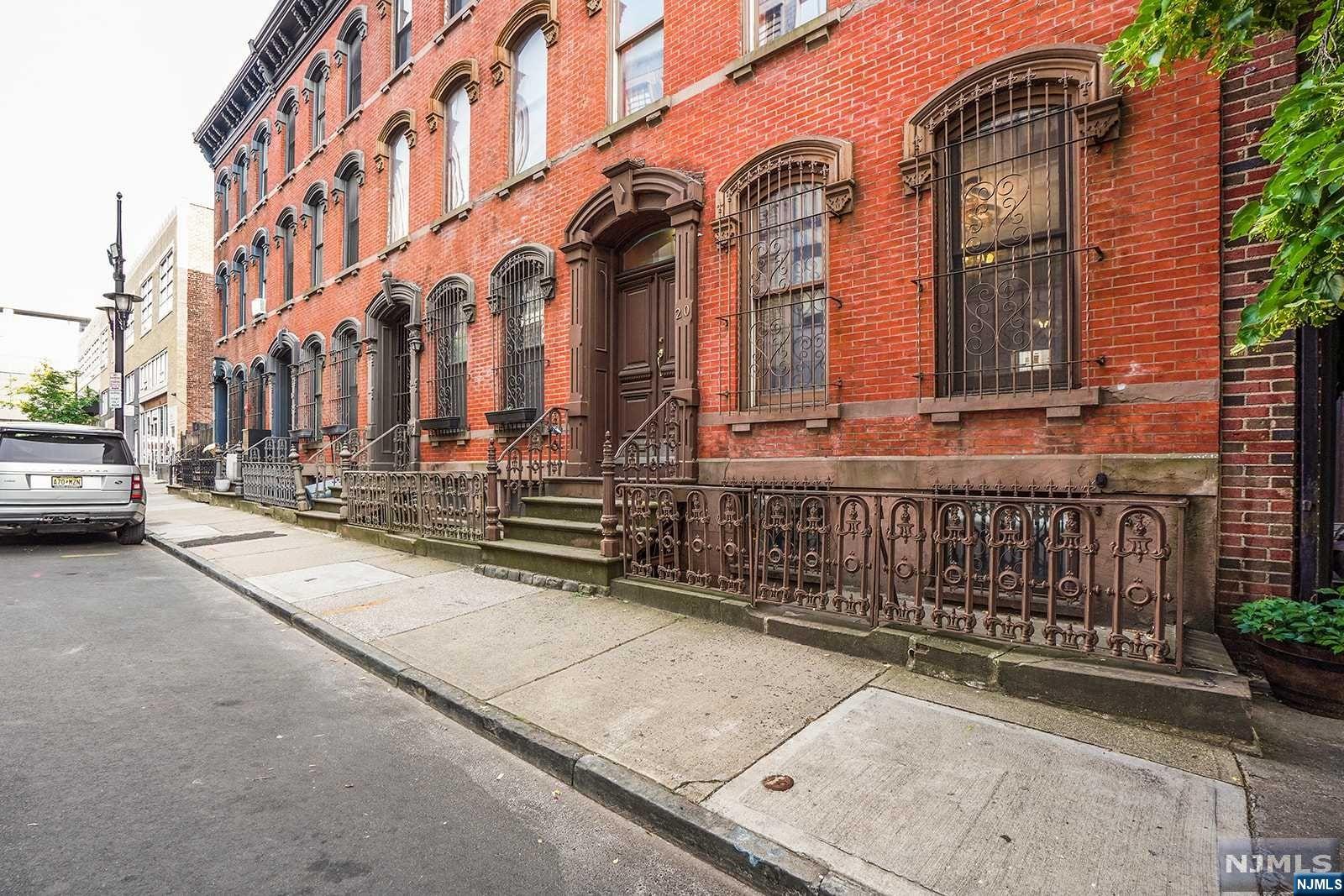Stunning and historic Brownstone nestled in the heart of Downtown Newark (right around the corner from Wholefoods and the light-rail!). Experience the best of city living in this charming, pre-war home built in 1880, boasting a wealth of character and timeless elegance. Located just steps from NYC transportation, the Newark Museum, Prudential Center, NJPAC, five universities, trendy restaurants, and picturesque local parks, this gem of a property offers the ultimate urban retreat for the discerning city dweller. Inside, you'll find soaring ceilings, exposed brick walls, pocket-doors and extra-large windows and outside a private backyard. Warm up by one of the two fireplaces that grace this enchanting home and relish in the historic charm that has been preserved throughout. This Brownstone also offers four generously sized bedrooms, two of which feature a private bathroom. The guest suite, complete with its private entrance and en suite bathroom, makes hosting visitors a breeze!