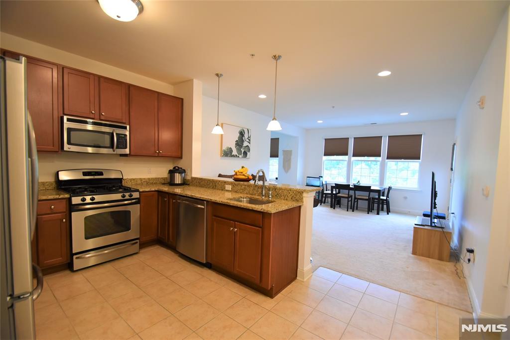 Avail for rent Immediately. LIVE THE GRANDE LIFE! Best location near clubhouse, pool, tennis, fitness. Beautifully updated Bayberry model located on the 3rd flr of elevator building No. 5. Featuring 1 bedroom with a Den, 1 bath, ldry rm, kitchen w/breakfast bar, liv/dining combo& balcony. Includes assigned garage space plus add'l parking. NO SMOKING. NO PETS. Tenant to obtain own renters insurance policy. Enjoy the Grande Life with all the amenities which includes 2 clubhouses with fitness ctrs, billiards rooms, conf rms, party rooms, tennis & basketball courts, 2 pools & much more!!Great location near all major highways, shopping & restaurants! Required credit ck, employment verif, 1 1/2 mth sec; 1st mth. $400 move-in fee & $750 Refundable sec dep.- Move-out fee.