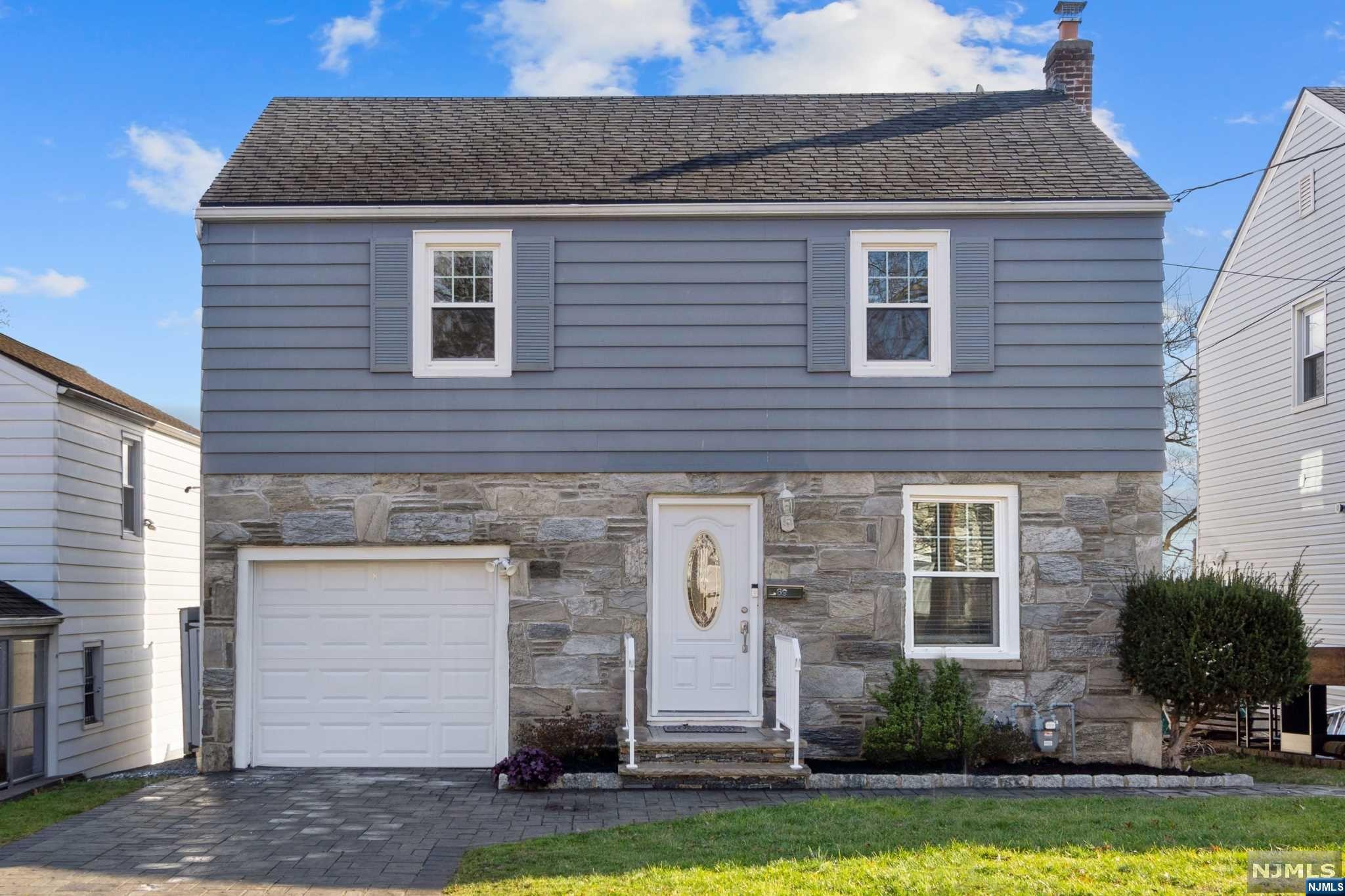 Welcome to this charming home in the desirable Delawanna section of Clifton on the Nutley Border! This property offers 3 bedrooms, 2 full baths, and an attached garage. As you enter, you'll be greeted by a spacious living room and a dining room that opens to a sliding door leading to a deck. The kitchen is well-appointed, providing a delightful space. Upstairs, you'll find three bedrooms and a full bath, offering privacy and comfort for all. The finished walkout basement is a fantastic bonus, complete with a full bath and a versatile rec room. This home is equipped with central AC, ensuring year-round comfort for you and your family. Outside, the backyard is a true oasis, featuring an above-ground pool, a patio, and a fenced yard, providing a private and serene space for outdoor enjoyment. Conveniently located, this home is just minutes away from the NYC Bus, making commuting a breeze. You'll also appreciate the proximity to shopping, parks, and schools.