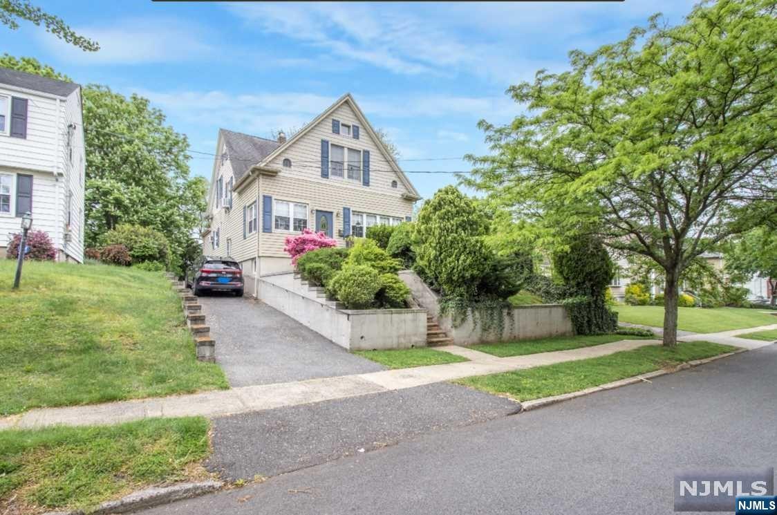 WELCOME to this charming 3 Bedroom colonial located in a desirable section of town that has had only TWO owners. Sit and relax while taking in the morning sun on the front porch or enjoy a cup of coffee in front of the wood-burning fireplace in the living room. The first floor is comprised of a living room, a formal dining room, kitchen, and family room with windows overlooking the yard. It has a roomy kitchen with plenty of counter space. Finally there is a full bath on the 1st level. Upstairs you'll find three bedrooms with the primary having two walk-in closets as well as the main bathroom. Potential mother/daughter or in-law suite in the fully finished basement where you'll find a full kitchen, full bath, living room, and separate room that can be used as a bedroom. Two car detached garage is set up to be a LARGE workroom with electric and a loft upstairs. This premiere location is close to major highways, NYC transportation, parks, schools, restaurants, shopping, etc.