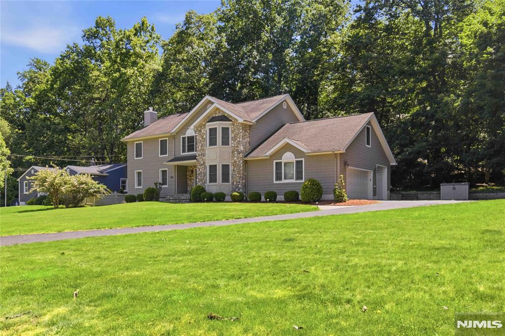 Sophisticated, spacious, and completely move-in ready, this beautifully renovated 4-bedroom, 3-bath home offers the perfect blend of modern style, comfort, and convenience. Renovated in 2018, the home features a thoughtfully designed layout suited to today's lifestyle. The heart of the home is the expansive lower level, where open-concept living and entertaining spaces flow seamlessly together. Whether hosting holidays, celebrations, or casual gatherings, this inviting space provides the perfect setting for entertaining and everyday living. The impressive primary suite serves as a private retreat, featuring a large walk-in closet and a versatile bonus room ideal for a home office, fitness room, sitting area, dressing room, hobby space, or additional flex space to suit your needs. Generous room sizes and tasteful updates throughout make this a true turnkey opportunityâ€”simply unpack and enjoy. An unfinished basement offers excellent storage and outstanding potential for future expansion and additional living space. Ideally located near the shopping, dining, and everyday conveniences of Franklin Lakes and just minutes from Ridgewood's vibrant downtown, known for its restaurants, boutiques, and charming village atmosphere. Commuters will appreciate easy access to NJ Transit bus service, nearby rail options, and a Park & Ride for convenient travel into New York City. A rare opportunity to own a move-in ready home that combines space, flexibility, and an exceptional location.