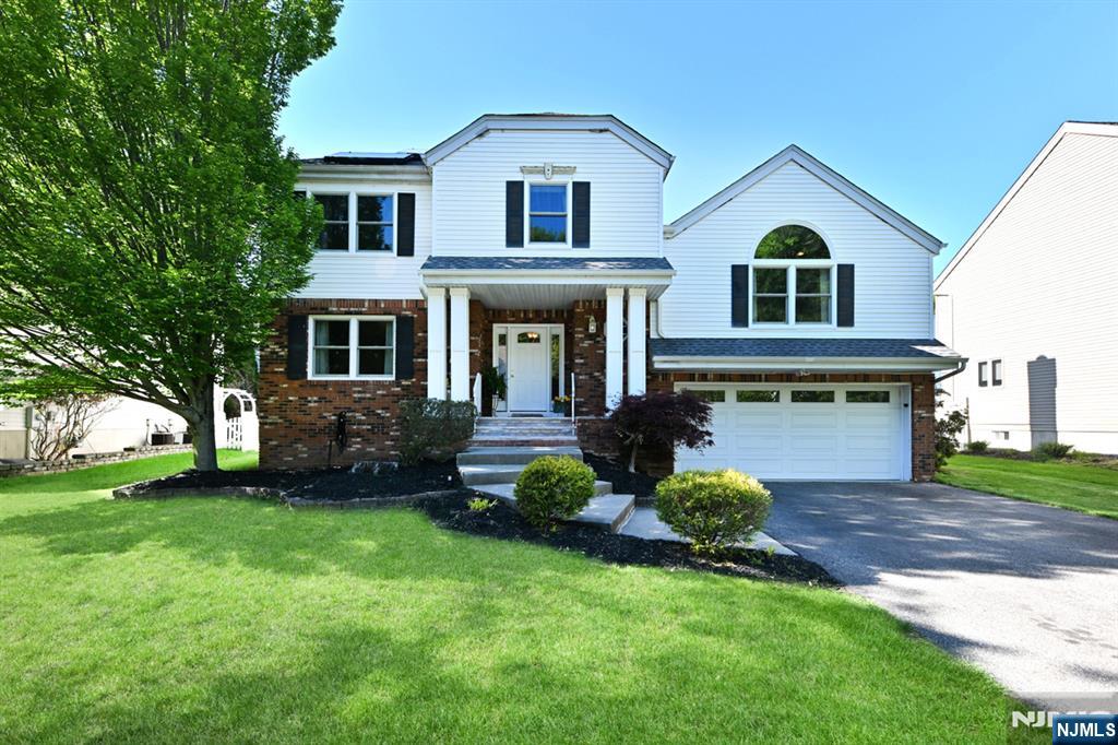 Wonderful place to call home! This Stately Colonial home offers beautiful curb appeal and is perfectly situated in a highly desirable, quiet location. Featuring updated windows, roof, central air conditioning, front entry door and so much more. Large Entry foyer leads to the formal dining room which opens to the spacious kitchen with large center island and dining area. The great room features a gas fireplace with marble hearth, soaring ceilings and beautiful, large picture window. On this level you will also find the 4th bedroom/den/office with walk-in closet. A few steps up lead to the primary, elegant bedroom with vaulted ceilings and large primary bath offering jacuzzi tub, shower stall and double sinks. This floor continues with 2 additional large bedrooms and full bath. The spacious lower level provides exceptional versatility with an office, large recreation room, laundry/powder room. Exterior offers a spacious deck overlooking the beautiful, private, fully fenced-in yard so come and enjoy your morning coffee and evening gatherings. All this and wonderful utility savings with the solar panels! Close proximity to schools, parks, River Vale and Westwood town centers. Love where you Live!