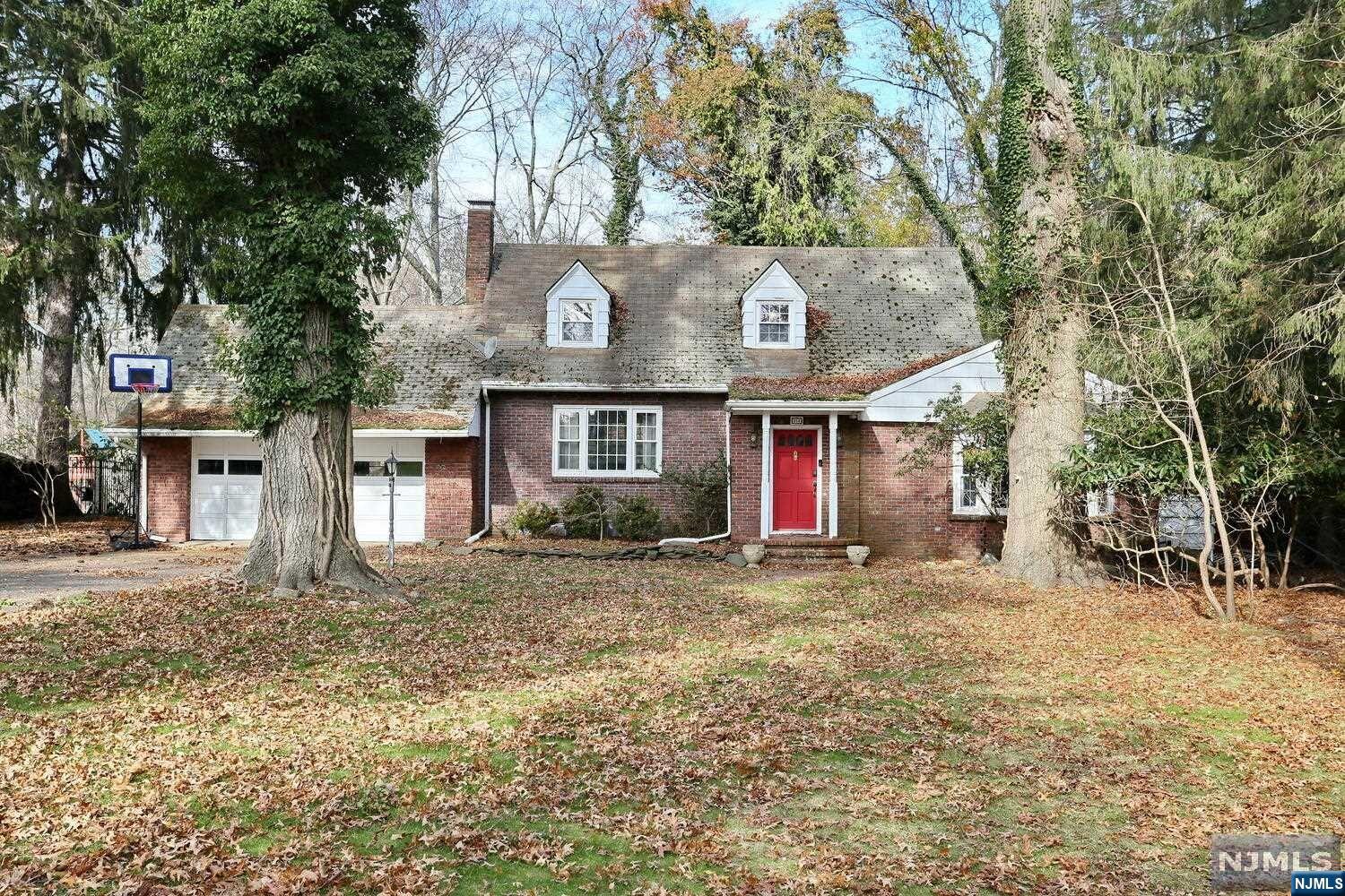 Nestled on a quiet, tree-lined street in River Vale, discover the allure of this 3-bedroom, 2-bath Colonial Cape Cod. Step inside and be greeted by an extra-spacious living room boasting a charming bay window seat. The adjacent dining room sets the stage for family gatherings, leading into a generously sized kitchen with eat-in area. Enjoy your morning coffee overlooking the serene and private backyard through the screened-in porch. A first-floor primary bedroom with 3 large closets and a full main hall bathroom offers convenience and flexibility, while the upper-level features two more bedrooms and another full bathroom. The lower level includes a fantastic family room, complete with a fireplace and another access to the large backyard. This house presents an extraordinary opportunity to expand and/or renovate into the home of your dreams. The house is being sold strictly in as-is condition. Envision the possibilities and don't miss out on this chance to call River Vale home!