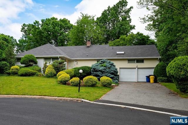 Welcome to 1044 E Lawn Ct! Boasting 4 bedrooms and 3 bathrooms, this home has been meticulously crafted. The layout is truly remarkable, featuring a generously sized living room complete with a cozy mother of pearl fireplace, a formal dining room, and a spacious eat-in kitchen. Throughout the home, you'll find beautiful hardwood flooring and notable features such as outdoor sprinklers, central AC, a double car garage, and a fully finished basement, which includes a rec room, laundry, and a full bathroom. Prepare to be amazed by the primary bedroom, designed to fulfill your dreams, complete with its own en-suite bathroom. The property also offers luxurious amenities, such as an indoor jacuzzi and an enclosed heated gunite pool, providing a soothing retreat within your own home. Situated just a few miles outside of New York City, it offers convenient access to express transit options for a short commute. This truly remarkable property presents a once-in-a-lifetime opportunity!