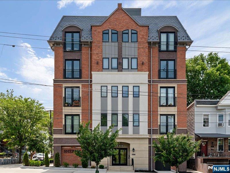 Welcome to Sherman Place, a luxury boutique building nestled in the heart of the Heights, steps from the newly restored Leonard Gordon Park - a breath of fresh air, without the upkeep. Unit 404 is a thoughtfully designed two-bedroom, two-bath condo with an open layout that feels both elegant and inviting. Crown molding, recessed lighting, and hardwood floors run throughout. The kitchen features shaker cabinetry, quartz countertops, Café appliances, including a gas range, and a center island, making it as beautiful as it is functional. In-unit washer and dryer included. Both bedrooms boast oversized walk-in closets with built-in shelving - because great storage is essential. The primary bath features a double vanity and glass-enclosed shower; the second offers a full tub. Solid concrete construction and sound-insulated walls make Unit 404 a peaceful retreat above it all. The crown jewel of Sherman Place is the stunning rooftop deck with sweeping views of the NYC skyline, the World Trade Center, the river, and the surrounding green spaces, making it the perfect spot to unwind or entertain. Building amenities include elevator access, secure package storage, and indoor bike storage. With a CitiBike station steps away, easy access to NYC bus routes, and walkable distance to restaurants, cafes, and parks, this location truly delivers. A dedicated parking space is available for purchase separately.