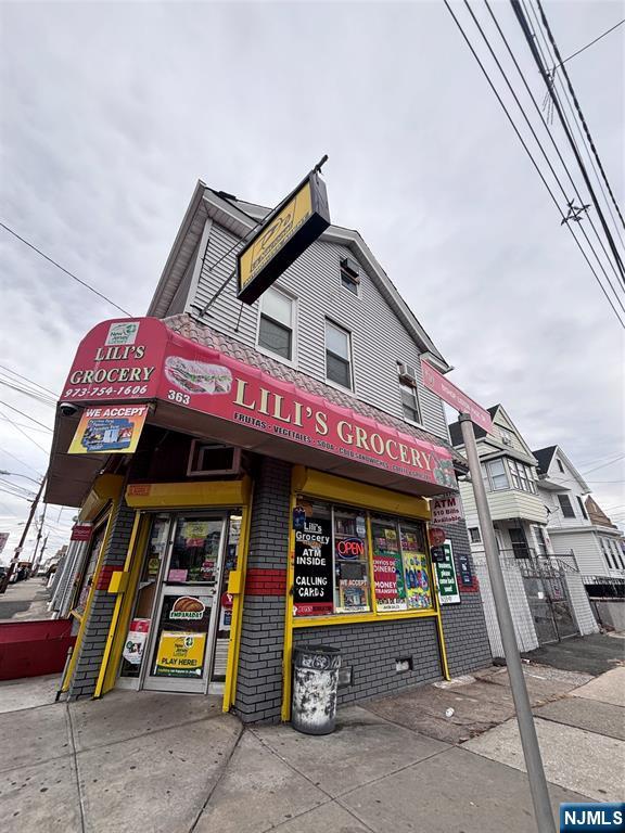 ATTENTION ALL INVESTORS!! Rare opportunity to own a mixed-use income-producing property featuring a well-established storefront bodega that has successfully operated for 27 years. Estimated gross monthly income of BUSNESS approximately $20,000. The property also includes a legal three-family residential building with all separate gas utilities. In addition, there is a 3-car garage and ample off-street parking for up to 6 vehicles. Residential units consist of: 1st Floor: 2-bedroom apartment, 2nd Floor: 2-bedroom apartment, 3rd Floor/Attic: 3-bedroom apartment with 1.5 baths. Both residential apartments will be vacant by the end of July, offering excellent opportunities for owner-occupants or investors seeking market-rate rents. All inspections have been completed. Green Card and survey are on file. Prime location with excellent exposure for business and investment purposes. Don't miss this exceptional opportunity to own a profitable mixed-use property with strong income potential!