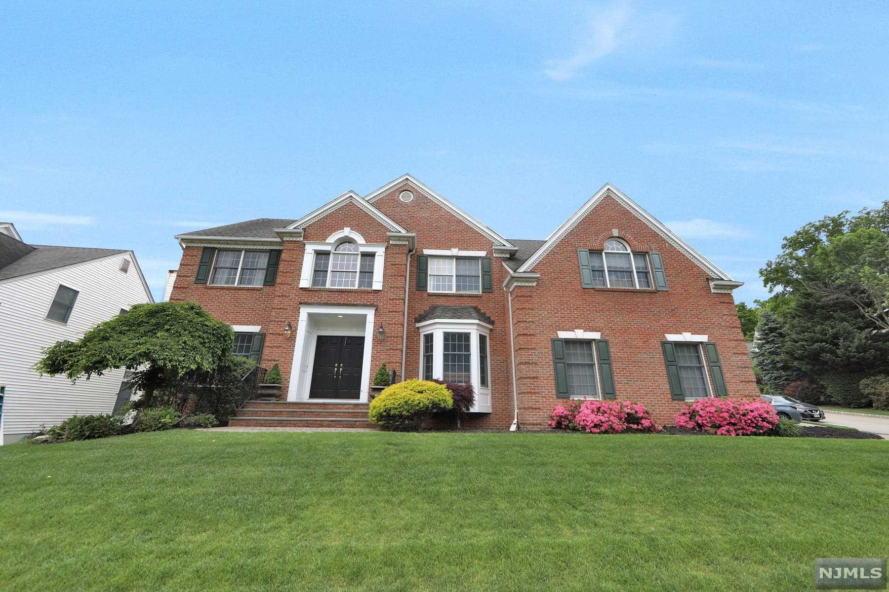 WELCOME TO THIS BEAUTIFUL CH COLONIAL W/SOARING CEILING HEIGHTS, 4 BEDROOMS,3 FULLBATHS & 1 HALFBATH. UPON ENTERING THE OPEN TWO STORY FOYER YOU ARE GREETED W/A BEAUTIFUL WINDING STAIRCASE, FRENCH DOORS THAT OPEN TO AN ELEGANT OFFICE W/FLOOR TO CEILING BUILT-INS, LG LIVING RM W/9 FT CEILING OPEN TO THE BANQUET SIZED DINING RM. LG EAT IN KITCHEN W/GRANITE COUNTER TOPS, ISLAND W/BREAKFAST BAR, DOUBLE OVENS,EATING AREA, FRENCH SLIDERS TO BACKYARD & OPEN TO GREAT RM W/VAULTED CEILING, WOOD/GAS FPL,MULTIPLE WINDOWS FOR NATURAL LIGHT & FLOOR TO CEILING BULT-INS,BEAUTIFUL MILLWORK THRU OUT, LG POWDER RM & SPACIOUS LAUNDRY RM. 2ND LEVEL HAS 3 LG BEDROOMS, LG FBA W/DOUBLE SINKS, LG MBR SUITE W/TRAY CEILING, BUILT IN DESK AREA, SITTING AREA & GREAT CLOSET SPACE. LG MBA W/JACUZZI TUB, VAULTED CEILING & DOUBLE SINKS. LOWER LEVEL IS FF W/REC AREA, GAME AREA, GYM AREA, FBA & BONUS RM. BKYRD IS LUSH & PRIVATE, IDEAL FOR ENTERTAINIG OR RELAXING.EXPRESS BUS TO NYC UP THE STREET, A MUST SEE HOME!