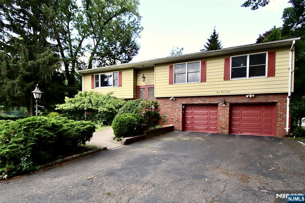 Location, Location, Location - Huge home in Desirable Milnes Area featuring 4 Bedrooms, 3 full Baths - (Primary bdrm w/ full bath, double closet, and walk-in closet) - Walk across the street to Elem and Middle School, NY trans - Newly finished Hardwood flooring throughout 1st floor - Huge Eat-in-Kitchen with quartz countertops and plenty of cabinetry. Spacious 3 Bedrooms and home freshly painted. Lower lever has huge Family rm, Bedroom, full bath, Storage Rm and Entrance to 2-car Garage - Perfect for extended Family. Utility rm has new Washer and Dryer - Fenced in spacious Backyard - Enjoy all the amenities Fair Lawn has to offer such as Bike Bath, Community Center, Activities and sports galore for all ages, Town pool with sprinkler center, park, tennis, pickle ball, dog park etc. - Many parks throughout the town - Walk to Houses of Worship -Fair Lawn is a great town to raise a family