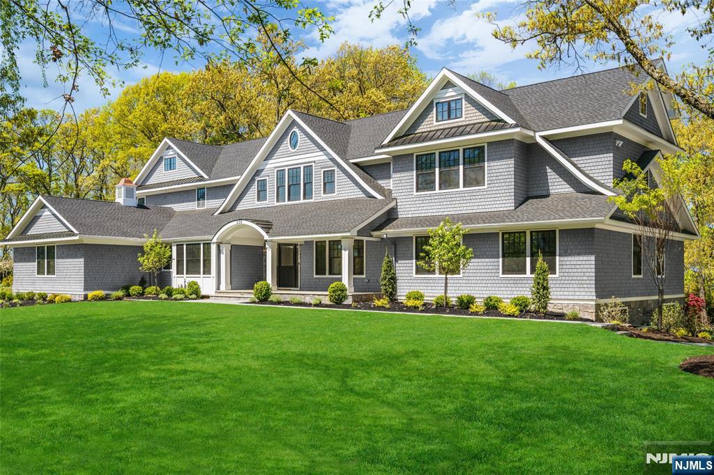 Builder incentives may be available for this new luxury Nantucket style home blended with refined modern touches in the sought after Hartshorn area of Short Hills. Set on a generous three quarter acre corner lot, this expansive 7 bedroom residence offers 6 full baths, 2 half baths, 2 offices and exceptional upgrades throughout. Highlights include a dramatic two story foyer, custom millwork, herringbone hardwood floors, California Closets and Restoration Hardware lighting. The gourmet kitchen features custom Medallion cabinetry, Caesarstone quartz countertops, Sub Zero refrigerator, Wolf appliances, 2 Miele dishwashers and a large center island opening to the family room. Two primary suites offer flexibility, including a first floor in law suite and an upstairs retreat with vaulted ceilings, exposed beams, dual walk in closets, radiant heated floors, soaking tub and glass shower. The finished walkout lower level is designed for everyday living and entertaining with a recreation room, gym, guest suite, wine cellar, lower pantry, art or hobby room and ample storage. Additional features include Nest thermostats, Ring security, Wi Fi boosters, whole house generator and heated 3 car garage with EV charging. Outside, enjoy professional landscaping, bluestone pathways, 2 driveways and approved plans for a heated Gunite pool and spa. Minutes to NYC trains, top rated Short Hills schools, downtown Millburn, nearby parks and the areaâ€™s premier shopping, dining and recreation.