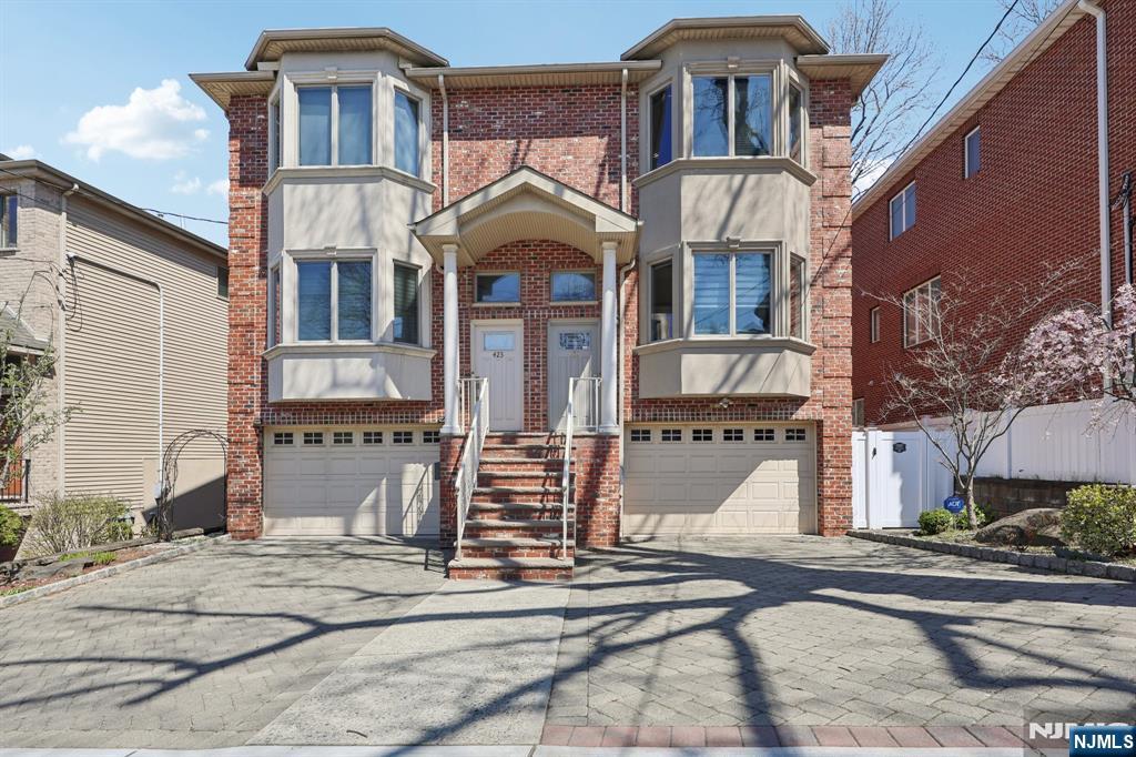 This beautifully designed luxury duplex built in 2008 is ideally located in one of the most desirable areas of Cliffside Parkâ€”perfect for families seeking comfort and convenience. No detail has been overlooked in the construction of this elegant home, featuring 3 spacious bedrooms, 2 full bathrooms, and 2 half baths. The home boasts hardwood floors throughout, high ceilings, and tasteful chair molding on both the first and second floors. The open-concept layout offers a warm and inviting family room with a GAS fireplace, seamlessly connected to a generously sized, high-end kitchen typically found in premium homes. Upstairs, youâ€™ll find the conveniently located laundry area, along with a stunning primary suite complete with a beautifully appointed en-suite bathroom. The fully finished basement features 9-foot ceilings and an additional bathroom, providing ample extra living space for recreation or guests. Additional highlights include an attached one-car garage, a private backyard perfect for relaxing or entertaining, and thoughtful recent upgrades: an EV charger has been installed, a smart thermostat adds modern efficiency and comfort, and a two-zone heating system ensures personalized temperature control throughout the home. Recently had the UPGRADES: HVAC SYSTEM(10yr warranty), AC PANEL, WATER HEATER, TOILETS, VANITIES (2 of the BTHs), BLINDS, FENCE, ARTIFICIAL GRASS. This is truly a must-see home!