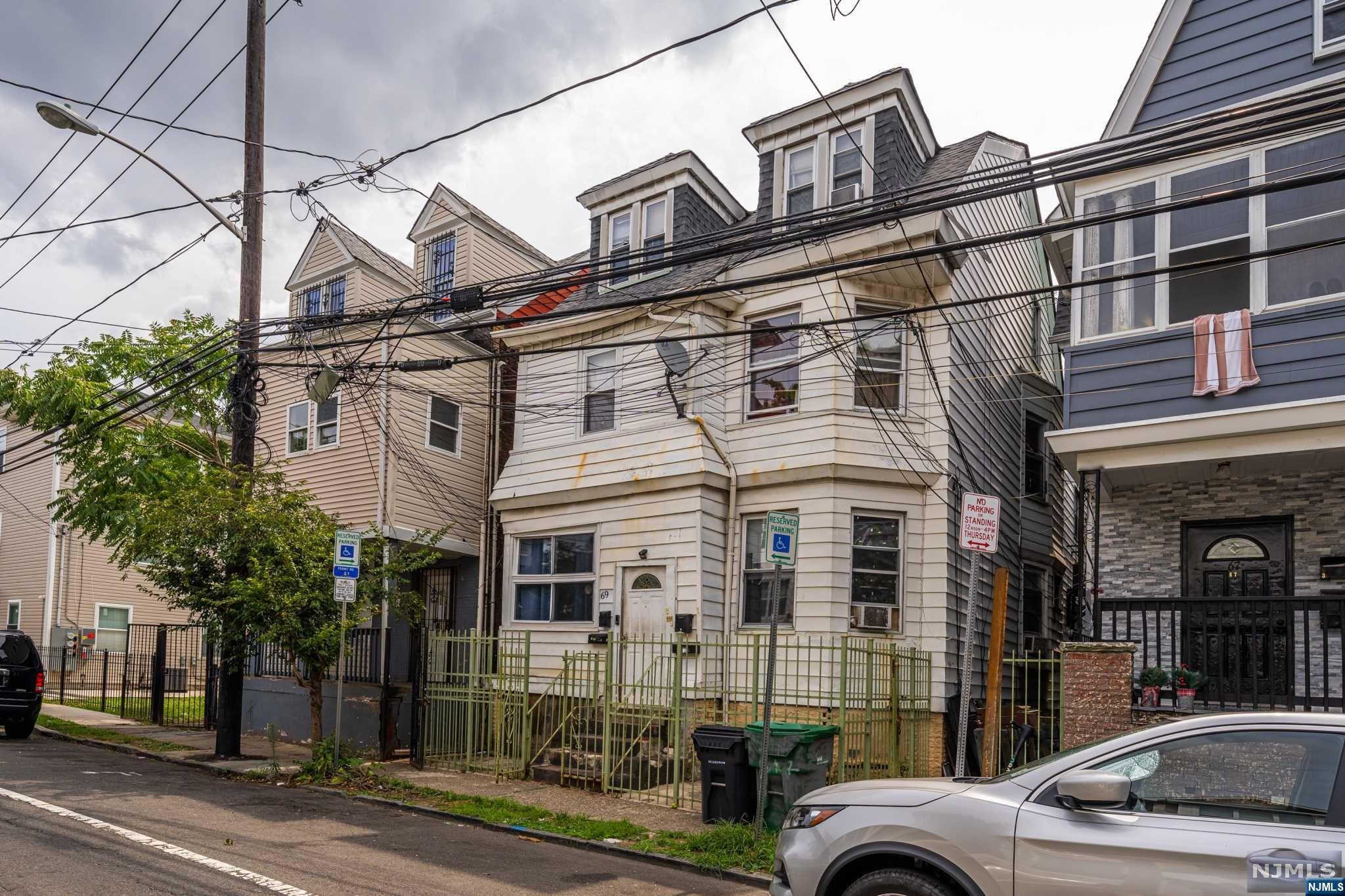 Welcome to this three-family house in North Newark. Incredible investment opportunity for those ready to take on a renovation project. The property features two main units, each offering three generous bedrooms, and a third unit with one bedroom and a full bath. Its prime location is just a stone's throw away from the beautiful Branch Brook Park and conveniently close to NJIT and highways. With some vision and effort, this property has the potential to become a highly desirable residence or rental property in a vibrant neighborhood. Don't miss out on this chance to transform a diamond in the rough into a valuable asset!