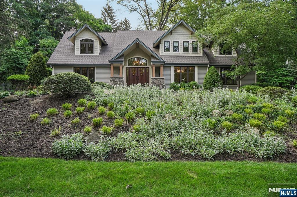 One-of-a-Kind Hartung Estate, Poised majestically atop a scenic knoll on a lush one-acre lot, this Craftsman-style Colonial exudes timeless grace and exceptional curb appeal. Call Henry Cannon for a private showing at 201.410.9607 Perfectly situated in the highly coveted "Hartung" section of Wyckoff, this residence offers a rare combination of sophisticated design and absolute privacy, creating a true sanctuary in a premier neighborhood. Step through the grand entry doors into a two-story foyer with gleaming hardwood floors that flow throughout the home. The heart of the residence is the stunning chefâ€™s kitchen, complete with a center island, granite countertops, custom cabinetry, and high-end stainless steel appliances. The kitchen opens seamlessly to an expansive Great Room, a sun-drenched gathering space featuring soaring ceilings with skylights, a versatile loft, and a cozy fireplace. Designed for effortless living, the home features a sought-after first-floor primary suite, part of a spacious 5-bedroom, 4.5-bathroom layout. The interior is further enhanced by a fully finished basement, providing ample space for a home gym, theater, or recreation room. The exterior is an entertainerâ€™s dream, where privacy abounds across professional landscaping, a beautiful patio, and a pristine gunite pool. Completing this exceptional estate is an attached, heated 3-car garage.