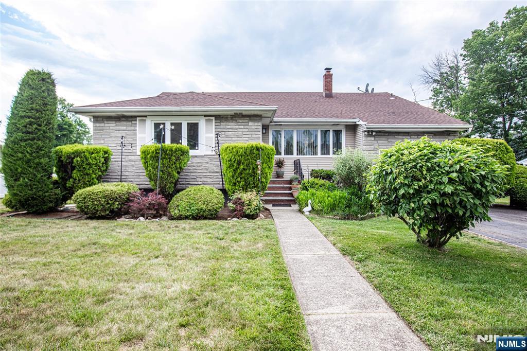 Located In The Heart of New Milford! Sunlight floods this lovely 3-bedroom, 2.5-bathroom home, offering the perfect blend of suburban tranquility and urban accessibility. The functional layout boasts bright living spaces, an expansive family room and hardwood floors protected under the existing carpeting. A partially finished basement adds excellent bonus square footage. Outdoor lovers will appreciate the oversized backyard, custom-tailored for entertaining, gardening, and alfresco dining. Enjoy close proximity to local schools, parks, premium shopping, and diverse dining options, with major transportation and NYC transit right at your doorstep.