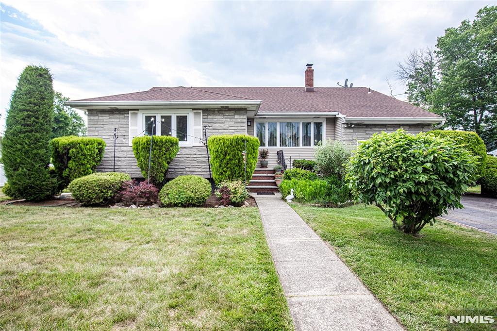 Located In The Heart of New Milford! Sunlight floods this lovely 3-bedroom, 2.5-bathroom home, offering the perfect blend of suburban tranquility and urban accessibility. The functional layout boasts bright living spaces, an expansive family room and hardwood floors protected under the existing carpeting. A partially finished basement adds excellent bonus square footage. Outdoor lovers will appreciate the oversized backyard, custom-tailored for entertaining, gardening, and alfresco dining. Enjoy close proximity to local schools, parks, premium shopping, and diverse dining options, with major transportation and NYC transit right at your doorstep.