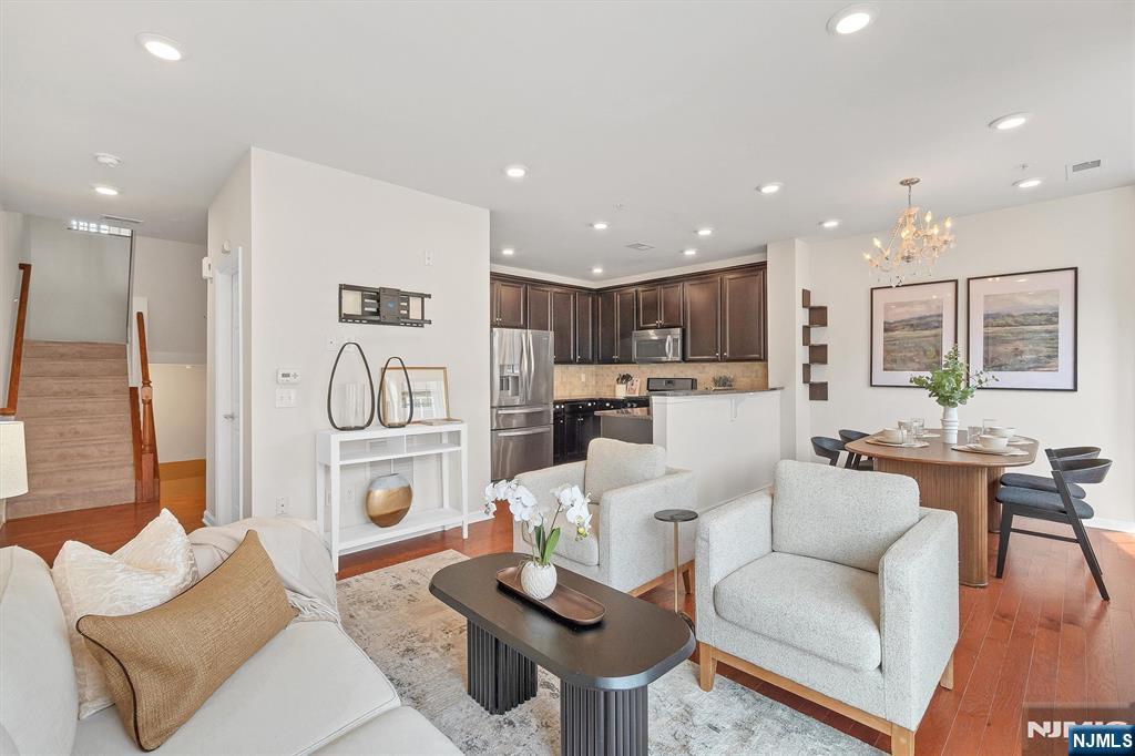Welcome to one of Bergen Countyâ€™s hottest and most desired townhome communitiesâ€”where luxury, comfort, and convenience converge just 12 miles from NYC. This beautifully upgraded 2-bedroom plus bonus family room, 2.5-bath townhome is the perfect combination of modern design and effortless living. The bright, open-concept floor plan showcases a stylish kitchen with custom cabinetry, energy-efficient stainless steel appliances, a generous pantry, and a private patioâ€”perfect for morning coffee or evening relaxation. Upstairs, discover a spacious bonus family room that offers flexible use as a media room, home office, or play area. The primary suite is a true retreat, featuring soaring ceilings, oversized windows, a custom walk-in closet, and a spa-like en-suite bathroom complete with a soaking tub and modern finishes. Located in a vibrant community with an on-site NJ Transit train station offering direct access to NYC via Secaucus or Hoboken, the home is also close to multiple bus lines, top-rated schools, major highways, and some of the best shopping and dining in the area. Enjoy unmatched amenities including two kidsâ€™ playgrounds, an athletic complex, tennis and basketball courts, a coffee shop, liquor store, and full-service pet grooming and boarding facilities. This home offers a lifestyle of ease and elegance in one of North Jerseyâ€™s most well-connected and amenity-rich neighborhoodsâ€”perfect for those who want it all.