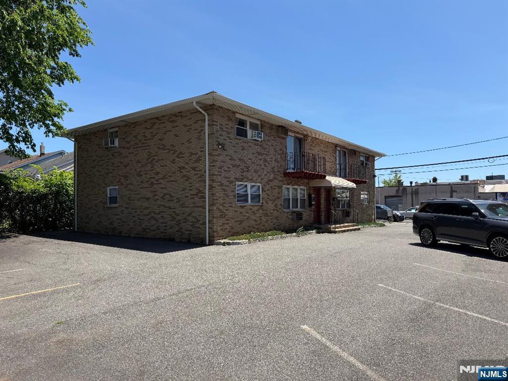 Discover this inviting 2 bedroom, 1- bathroom first-floor condo in a well maintained 4-unit brick building. Featuring a spacious living room and a large eat-in kitchen, this condo offers comfortable living with plenty of natural light. Enjoy the convenience of on-site laundry and ample parking. Whether you're looking for a primary residence or an investment opportunity, this property checks all the boxes. Don't miss out schedule your appointment today!