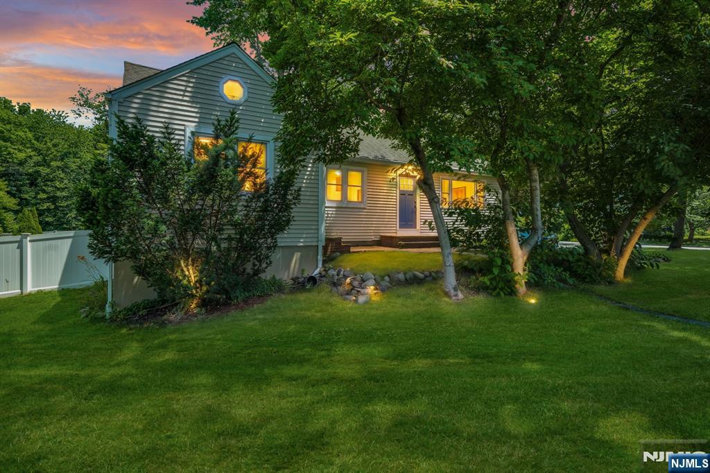 Positioned on a generous, fully fenced corner lot at the corner of 2nd Avenue, this freshly painted 5-bedroom, 3-full bath home offers space, flexibility, and the opportunity to make it your own in one of Roseland's most desirable neighborhoods. Enjoy a nearby park, small-town charm, and an easy commute, with shopping, dining, major highways, and NYC transportation just minutes away. Step inside to a bright, welcoming interior featuring a sun-filled living room, white eat-in kitchen, inviting family room, and hardwood floors throughout much of the first level. The first floor also offers two bedrooms and two full baths, including a private ensuite with its own entrance, sitting room, walk-in closet, and full bath. A second bedroom, currently used as a home office and laundry room, offers added flexibility. Upstairs are three additional bedrooms and a full bath. The full basement with Bilco doors provides abundant storage and future finishing potential. Additional highlights include a wood-burning stove, three-zone baseboard heat, a 2-year-young Navien tankless water heater, whole-house water filtration system, freshly painted side porch, ample parking, and a spacious fenced backyard. Served by highly regarded Lester C. Noecker School (Pre-K-6, Niche Grade A+) and the acclaimed West Essex Regional School District, this home offers the perfect blend of comfort, convenience, and location.