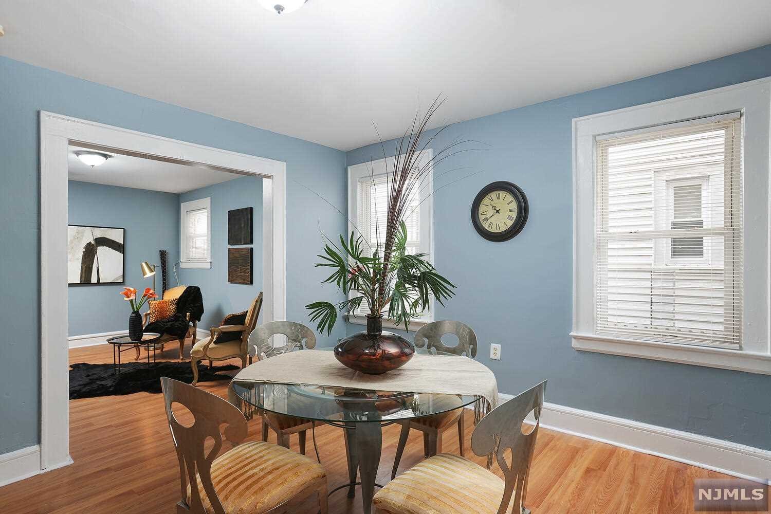 EXCEPTIONAL CUSTOM Colonial WITH 4 BEDROOMS & 2 BATHS NESTLED IN Vailsburg WITH CLOSE PROXIMITY TO PUBLIC TRANSPORTATION. This home offers an incredible open floor plan with enclosed porch, living room, large dining room and a gorgeous gourmet eat-in kitchen with counter-top, base molding, appliances, back splash, lighting and a breakfast nook with pantry. 2nd & 3rd FL features 4 spacious bedrooms with bath. Lower level Au Pair/in-law suite with 2 bedroom, bath, 2nd kitchen, sitting room, utility closet, Separate entrance and a large private backyard perfect for all occasions with parking.