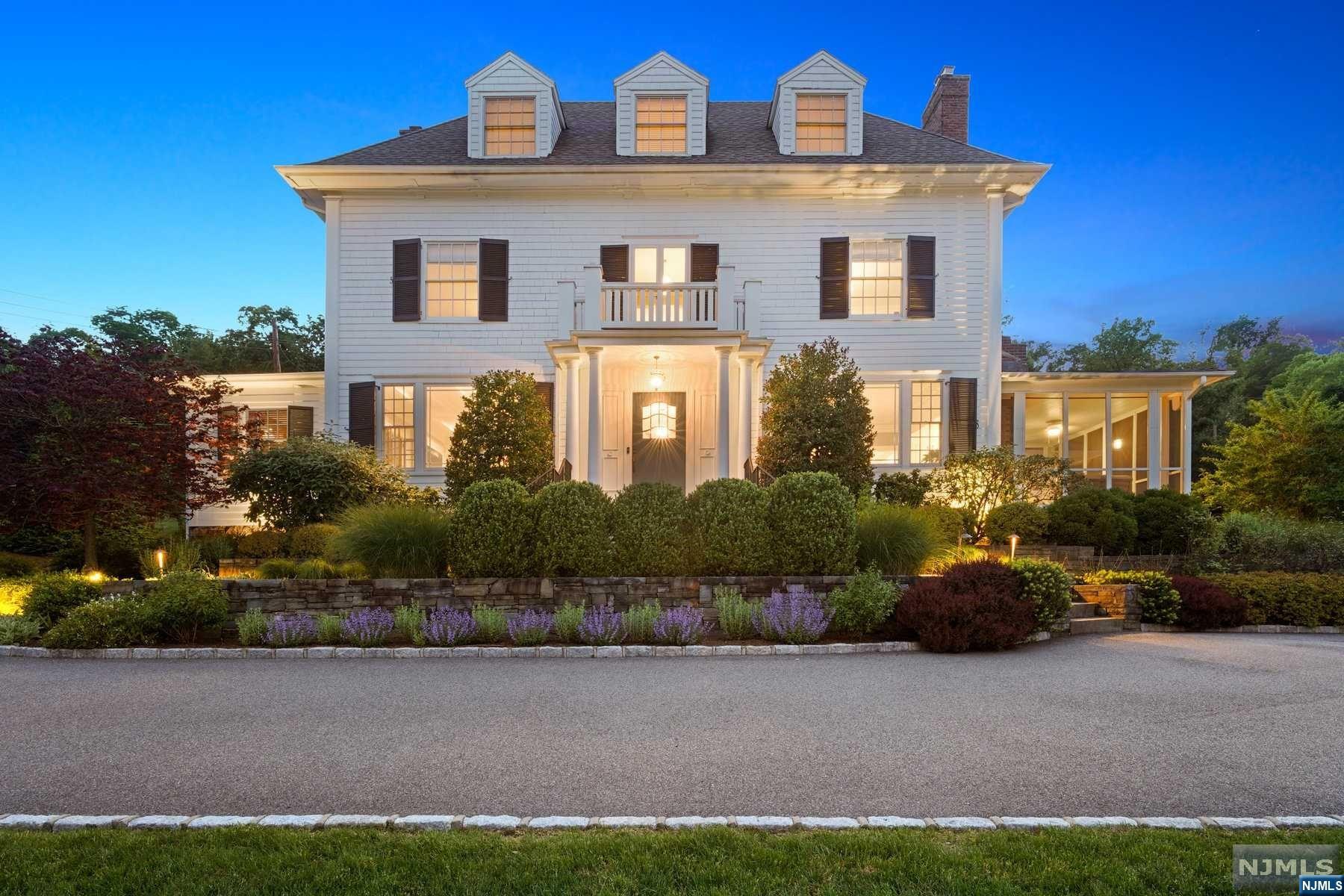 "My favorite house in Montclair', says EVERYONE! Perched on 1.5 acres with views of the NYC skyline, this gem blends historic charm with contemporary comforts. 13 miles from NYC & blocks from Watchung Plaza & Uptown's restaurants, shops, & the NYC train, it offers high ceilings, huge windows, a stunning staircase, & meticulous detail. Olympia Dukakis called it home for 30 years. Features include a chef's kitchen, new family room, private bluestone patios, & a screened porch. Luxurious primary suite has a marble bath & dressing room. Two more bedrooms and a sitting room are on the 2nd floor, with another bath. The 3rd floor has two bedrooms (one as a rec room), a bath, and ample storage. Enjoy a dry, lower-level gym, wine room, and laundry center. Central air, 3 fireplaces, hardwood floors, and all the upgrades. Warm and welcoming, not pretentious. A 2-car stone garage with storage completes the package. This house will make your life better!