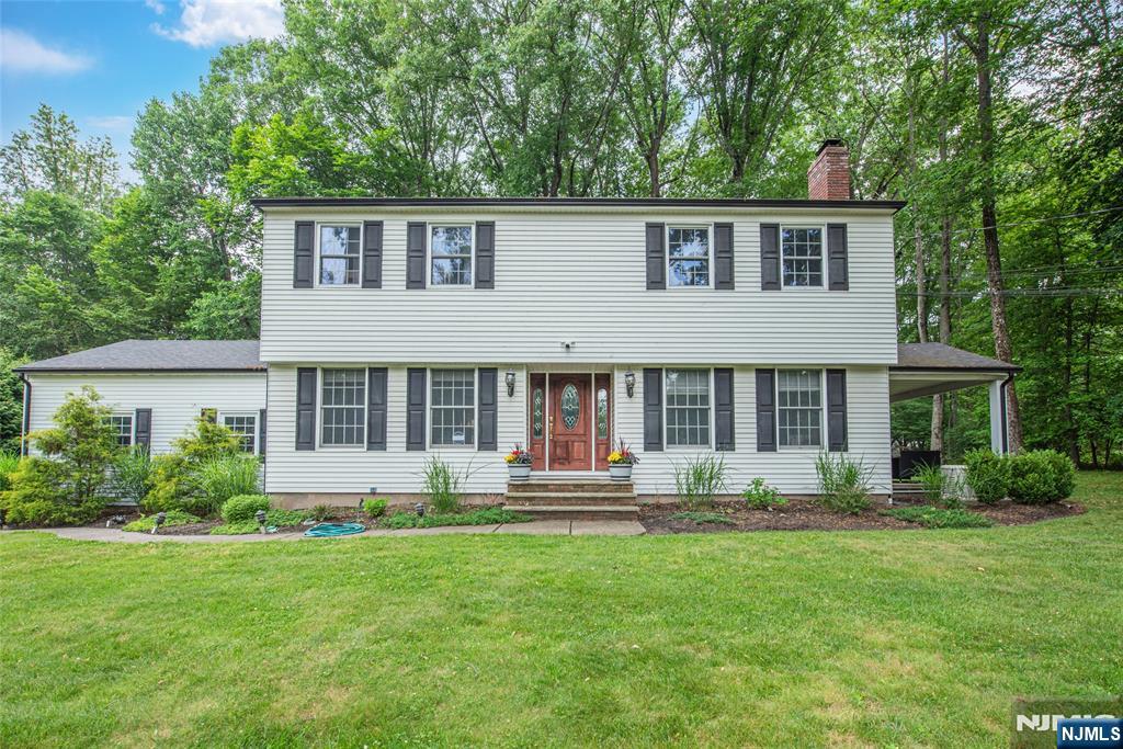 Nestled in one of Woodcliff Lake's most coveted and serene neighborhoods, this Colonial presents a rare opportunity to own nearly 3/4 of an acre of Bergen County prime real estate on the hill. The home features 4 bedrooms, with the possibility of a 5th, and 1.5 baths, alongside a finished basement and a 2-car attached garage. Significant updates include a new roof, whole house generator, central air, and a new hot water heater, offering great peace of mind. With endless potential. Enjoy the convenience of being near transportation, shopping, schools, parks, and houses of worship.