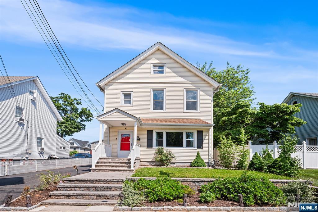 The opportunity you've been waiting for in Englewood! This beautifully updated Colonial welcomes you with wonderful curb appeal on a quiet block just minutes from downtown shopping, dining, and everyday conveniences. From the moment you enter, soaring ceilings and rich hardwood floors create a warm, inviting atmosphere filled with character and natural light. The kitchen is a true standout featuring a center island, granite countertops, ample cabinets, a water filtration system with an insta-hot dispenser (2025), newer refrigerator (2024), and an ideal layout for entertaining. A mudroom with extra storage and a full bathroom adds functionality to the main level. Upstairs, you'll find 3 well-appointed bedrooms with excellent natural light and an additional full bathroom. The home features a full attic with insulated, finished walls, new pull-down stairs (2025), and architectural plans for a future permanent staircase conversion. The finished basement provides valuable bonus space perfect for a recreation room, home office, or gym, complete with another full bath. Additional highlights include a newer hot water heater (2022), central air, and a Vivint security system. Enjoy a low-maintenance brick patio, plus a detached two-car garage with a brand-new custom garage door, and long driveway. Conveniently located near houses of worship, schools, parks, Englewood Hospital, major highways, and the GWB for an easy Manhattan commute. Move-in ready and exceptional value!