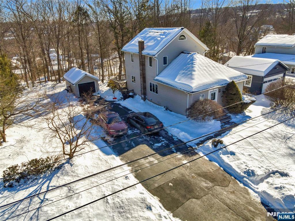Well-maintained 3-bedroom, 2-bath Colonial located on a quiet residential street. This inviting home features a spacious living room that flows into a combined living and dining area, perfect for entertaining. The eat-in kitchen offers custom cabinetry, stainless steel appliances, center island, and quartz countertops, with sliding glass doors leading to the rear deck. The first floor includes a flexible bedroom ideal for a primary suite or home office, along with a full bath. Upstairs are two additional bedrooms, a full bath with glass-enclosed tub/shower, and a convenient second-floor laundry room. The full unfinished basement provides ample storage. Enjoy outdoor living with a large rear deck and a newly paved 20â€™ x 35â€™ patio overlooking a wooded backyardâ€”great for play, relaxation, and gatherings. Additional features include a detached one-car garage, ample driveway parking, newer heating and A/C, new septic system, new roof, and new solar panels. Conveniently located near NYC transportation, shopping, and dining. Subject to sellers finding a suitable housing.