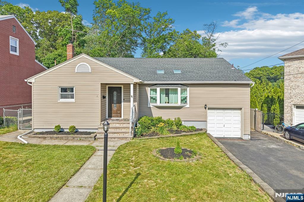 Welcome to 84 Howard Place, a beautifully updated 3-bedroom, 3-full-bath backsplit home set on one of Nutley's most desirable streets. Perfectly positioned in Nutley, this home offers the space, location, and lifestyle buyers have been waiting for. Step inside to a spacious living room with soaring ceilings that perfectly complement the beautiful stone wall, creating a warm and impressive first impression. The living and dining rooms flow into the updated kitchen, giving the home an inviting open-concept feel. The kitchen features gorgeous stainless steel appliances, modern finishes, and a layout ideal for everyday living and entertaining. Upstairs, you'll find three comfortable bedrooms, including a primary suite with a stunning ensuite bath complete with a floating tub and shower. An updated hallway bath serves the additional two spacious bedrooms. The lower level expands the home even further with a family room, sitting area, office, access to the attached garage, a full bathroom, and multiple access points to the backyard. The basement offers even more flexibility with an additional office/den, large laundry area, utility room, and excellent storage. Outside, enjoy a large multi-level backyard with a patio, covered sitting area, and grill space. With beautifully finished hardwood flooring through the upper 2 levels, newer roof, 2-zone central air, an attached garage, attic storage, generous closets, and multiple bonus spaces, this Nutley home truly has it all!