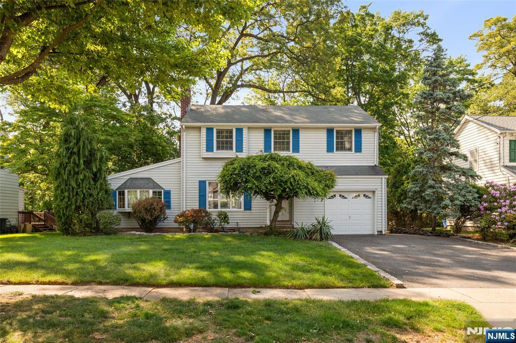 Well-maintained 4 bed, 1.5 bath home tucked away on a quiet street in one of River Edge's most desirable neighborhoods. Set on a beautifully landscaped property & wonderful curb appeal, the backyard borders Van Saun County Park w/ a large natural barrier of mature trees creating a rare, private & peaceful setting. A large 2 tier deck w/ newer French doors creates seamless indoor outdoor flow perfect for entertaining or relaxing. The 1st floor features a formal living room w/ wood burning fireplace, dining room, spacious kitchen & sunroom while creating an ideal layout for everyday living & entertaining. Filled w/ warmth & character throughout, the home features generously sized bedrooms, abundant natural light, hardwood floors, elegant wood trim, freshly painted interior, ample storage, large closets, finished basement providing additional flexible living space & an attached garage. As well as, an updated electrical panel & newer water heater. Conveniently located just 5mins. from the River Edge Train Station & close to Routes 4, 17 & the Garden State Parkway, this home offers easy commuting w/ the NYC bus to Port Authority down the street & the George Washington Bridge less than 9 miles away. Just minutes from highly ranked Roosevelt Elementary & River Dell Middle / High Schools, while also close to Bergen County Zoo, Veteran's Memorial Park, plus shopping & dining along Kinderkamack Rd, The Shops at Riverside Mall, Bergen Towne Center & Garden State Plaza. Don't miss out!