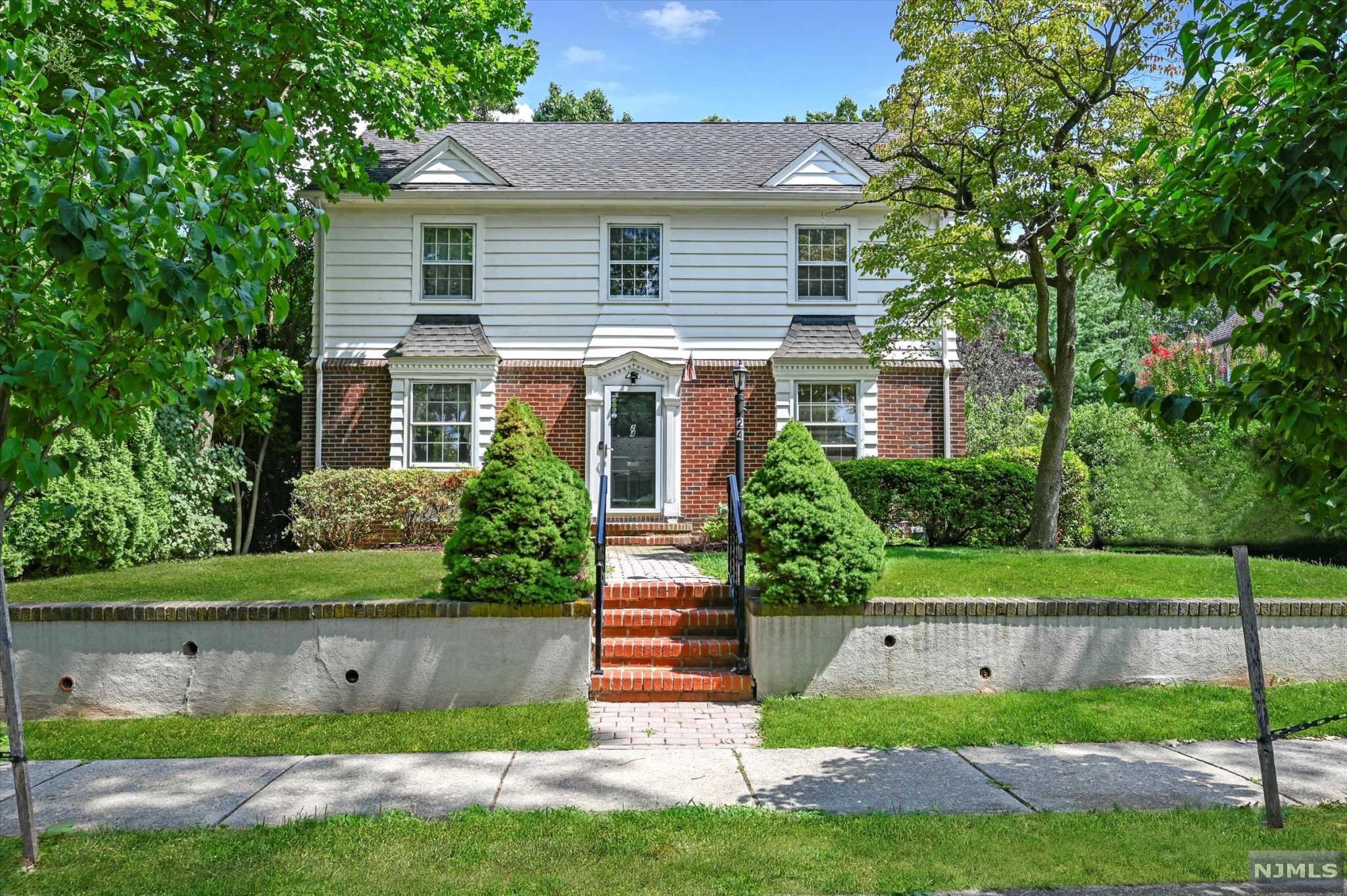 This classic center hall Colonial is located on a quiet, tree lined road in the Nutley Park section of town! With some finishing touches, this home could be perfect for you. Expansive living room with wood burning fireplace overlooks window encased den. The formal dining room is mirrored on left side of foyer and leads into kitchen with a cozy breakfast nook area. Carpets recently removed to show hardwood floors. A full bathroom completes the first floor. Second floor boasts three well-sized bedrooms with functional closet space, one being a walk-in closet! Back bedroom has a balcony entrance, with possibilities of a room expansion or continued use as a pleasant 3 season area that overlooks backyard. Full basement can be converted to rec room, office space or anything that may fit your desires. Large, private backyard filled with luscious greenery has ample space for future patio and pool. This home is located near Nutley's park system, public transportation, & short drive to ON3