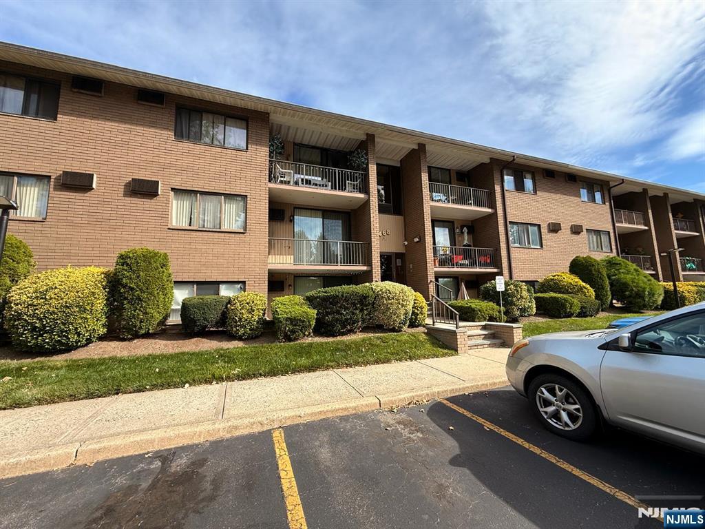 This beautifully updated 2-bedroom, 2-bathroom condominium offering spacious living and a host of contemporary comforts. Both bedrooms are generously sized, with the second bedroom featuring custom built-in cabinetryâ€”perfect for extra storage or a stylish home office setup. Enjoy cooking and entertaining in the eat-in kitchen, complete with all electric appliances, a wine refrigerator, and a dishwasher. Bamboo flooring flows throughout the main living spaces, adding warmth and elegance to the home. Stay comfortable during those warm summer months with three efficient AC wall units, and relax on your private balcony after a long day. The community offers a sparkling on-site swimming pool, as well as a convenient laundry room. Whether you're a first-time buyer, downsizing, or looking for a smart investment, this condo combines modern living with practical features in a location that offers easy access to local retail shops, restaurants,major highways and NYC. Cats Allowed, Dogs Prohibited. Listing agent is related to the owner. Parking is an additional $15.00 per car.