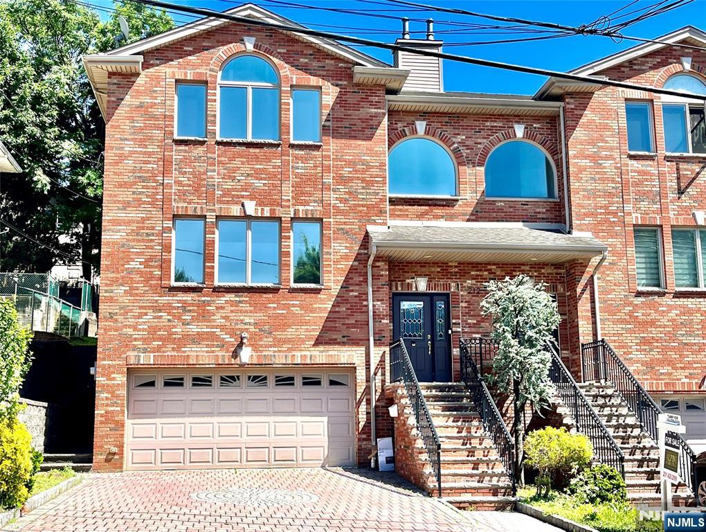 Well built by a reputable builder on 75 X 100 lot with 4 Bedrooms on 2nd Fl. + bonus 5th bedroom or family room on 1st Fl. with 9 feet high ceiling. The unit has an open layout living room and kitchen, walk out patio, marble bathrooms, 2 fire places and true 2 car garage. Walking distance to NY express bus and easy access to Rt 46 and GW Bridgeâ€¦. Must See!!!